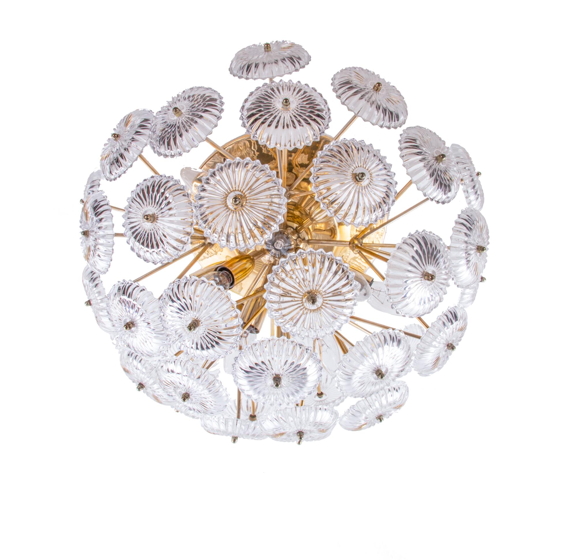 This stunning large and glamorous flush mount ceiling light has a high quality gilded brass base with thirty-six crystal glass flowers. Manufactured by Palwa, Germany in the 1960s. 

Measures: diameter 21.65