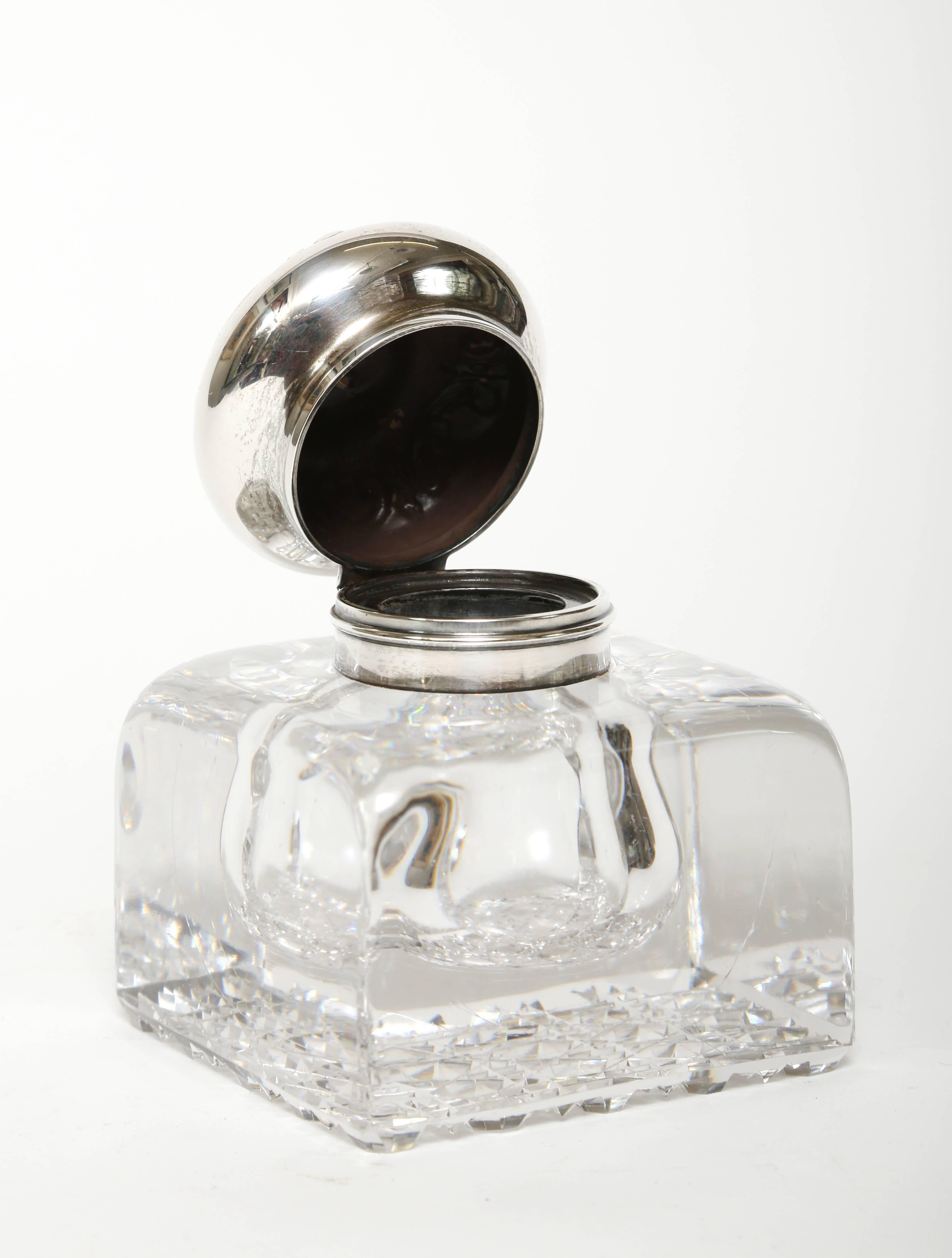 Large 19th century blown crystal inkwell with a hand-cut base in the cane pattern. When fabricated an air bubble was created inside the glass base to hold the ink. The sterling silver hinged top was made by The Old Gorham Silver Company of