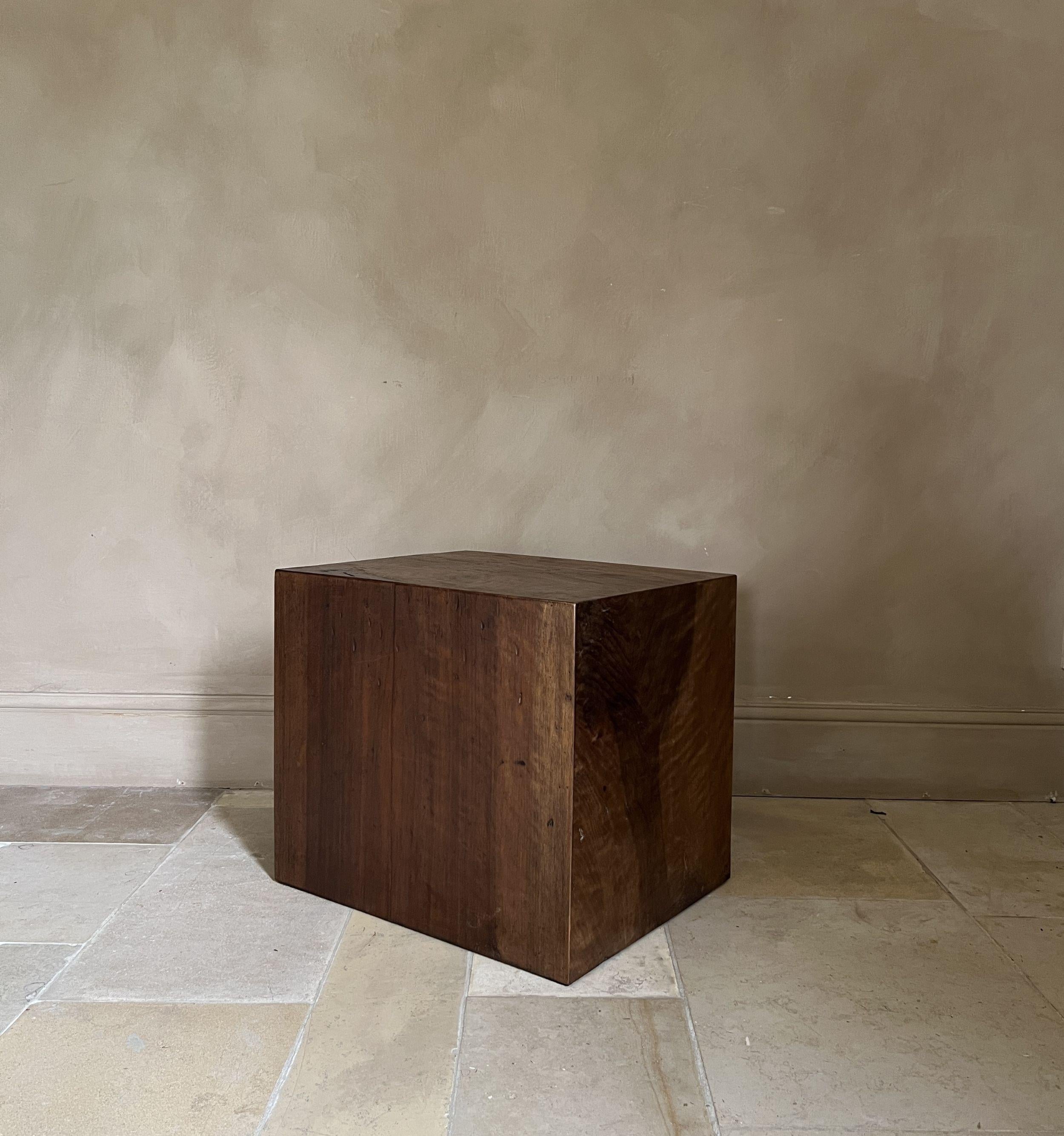 Our cube sidetable is made from 19th century walnut. All sides are in one piece slabs of the same plank. While upholding golden cut proportions these small sidetables are as versatile as beautiful. It can be used as piedestal, sidetable or stool.