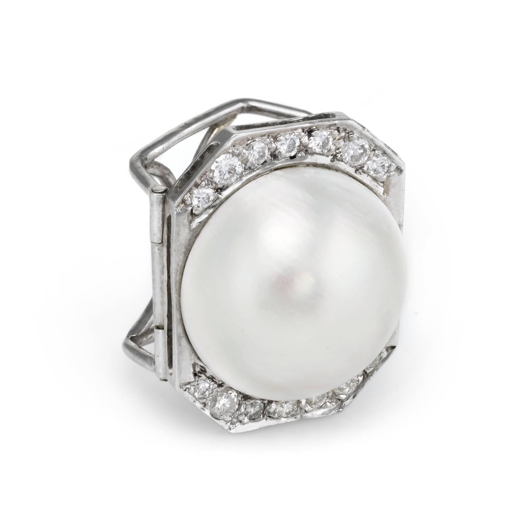Finely detailed enhancer pendant, crafted in 14 karat white gold. 

Large cultured Mabe pearl measures 18mm, accented with an estimated 0.40 carats of round brilliant cut diamonds (estimated at I color and SI1-2 clarity). The pearl is lustrous and
