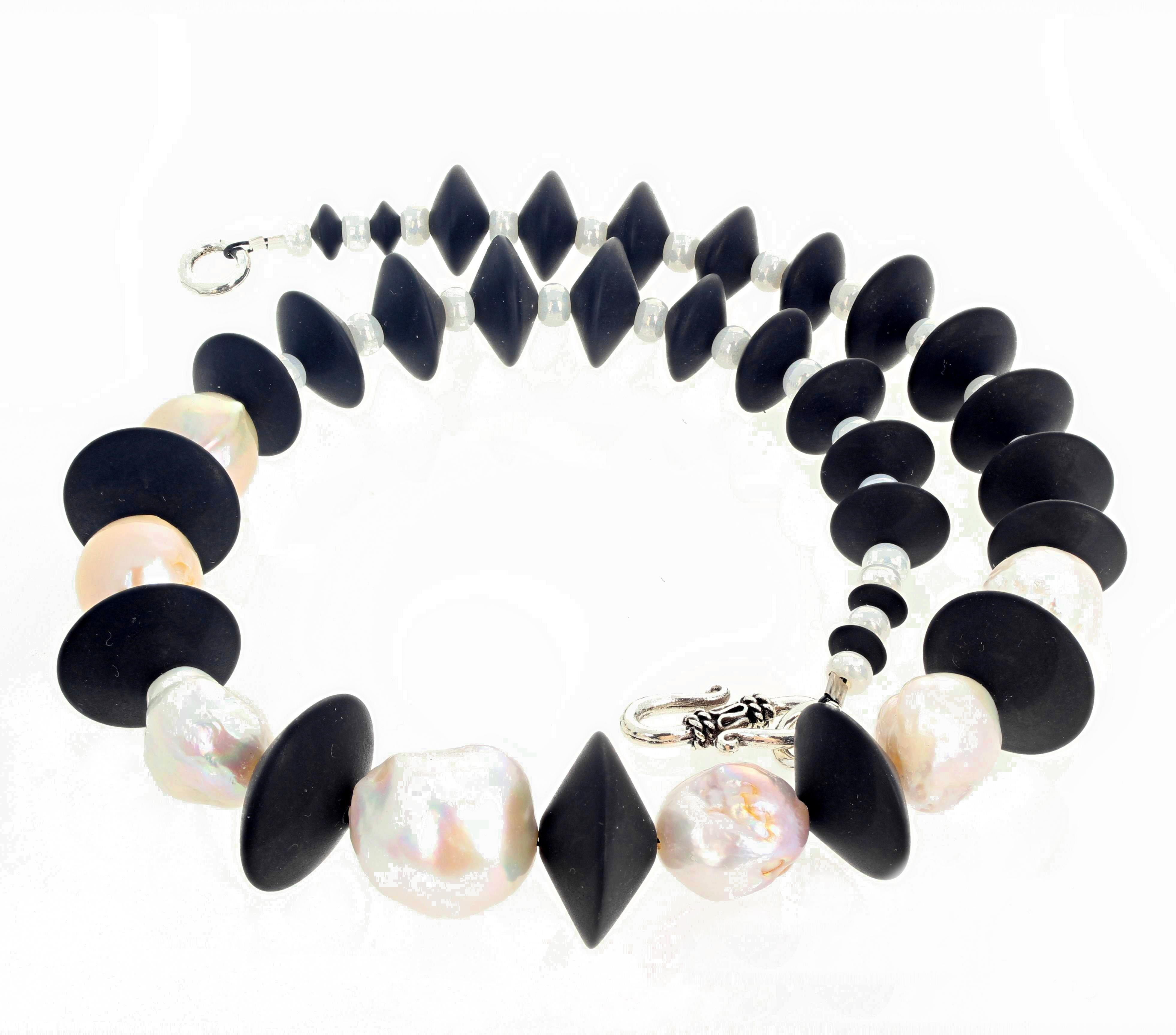 Amazing different glowing natural Pearls enhanced with lovely polished natural Black Onyx rondels set in this superbly elegant 17 inch long necklace with silver hook clasp.  The largest pearl is 17 mm.   If you wish faster delivery on your purchase