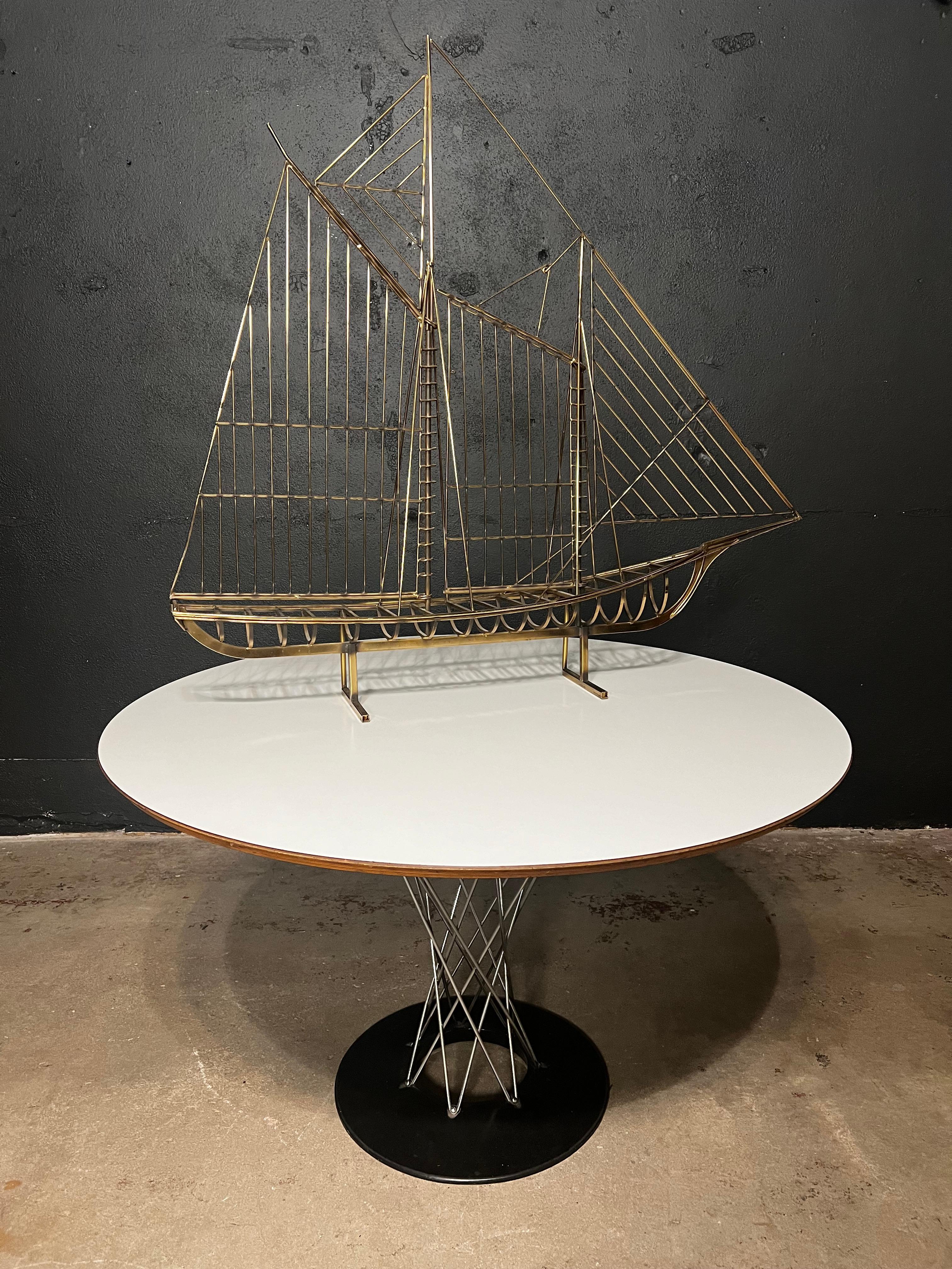 The large wire boat by C. Jere is a captivating sculpture that masterfully combines craftsmanship and artistic flair. Created by Curtis Jere, known for their wonderfully designed metal wall sculptures, this piece features intricately woven wirework
