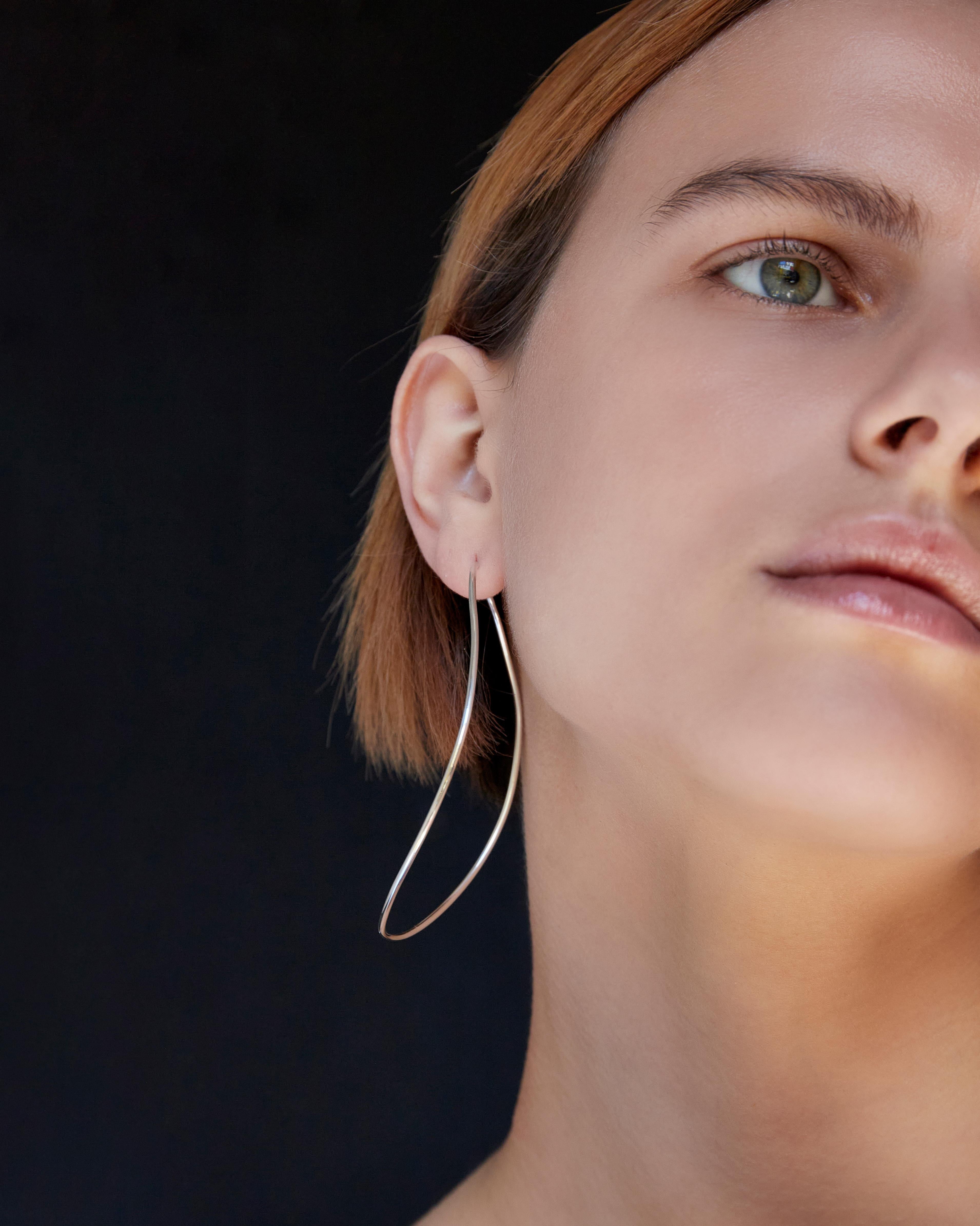 BAR Jewellery, London UK, SILHOUETTE EARRINGS, Sterling Silver 

The gentle curves of the Silhouette hoops are inspired by the work of Modernist artists such as Terry Frost and Barbara Hepworth, who worked in the British town of St Ives in the