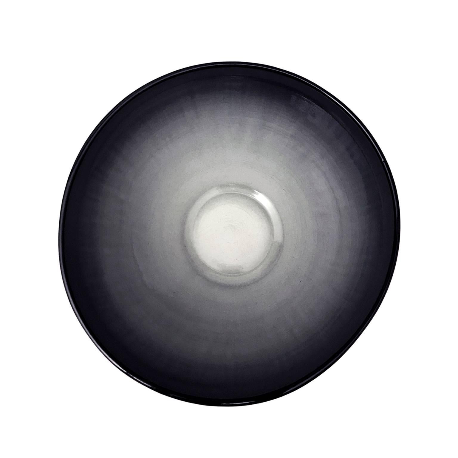 Large curved ceramic bowl with ombre glaze by Sandi Fellman. USA, 2018.

Veteran photographer Sandi Fellman's ceramic vessels are an exploration of a new medium. The forms, palettes, and sensuality of her photos can be found within each piece. The