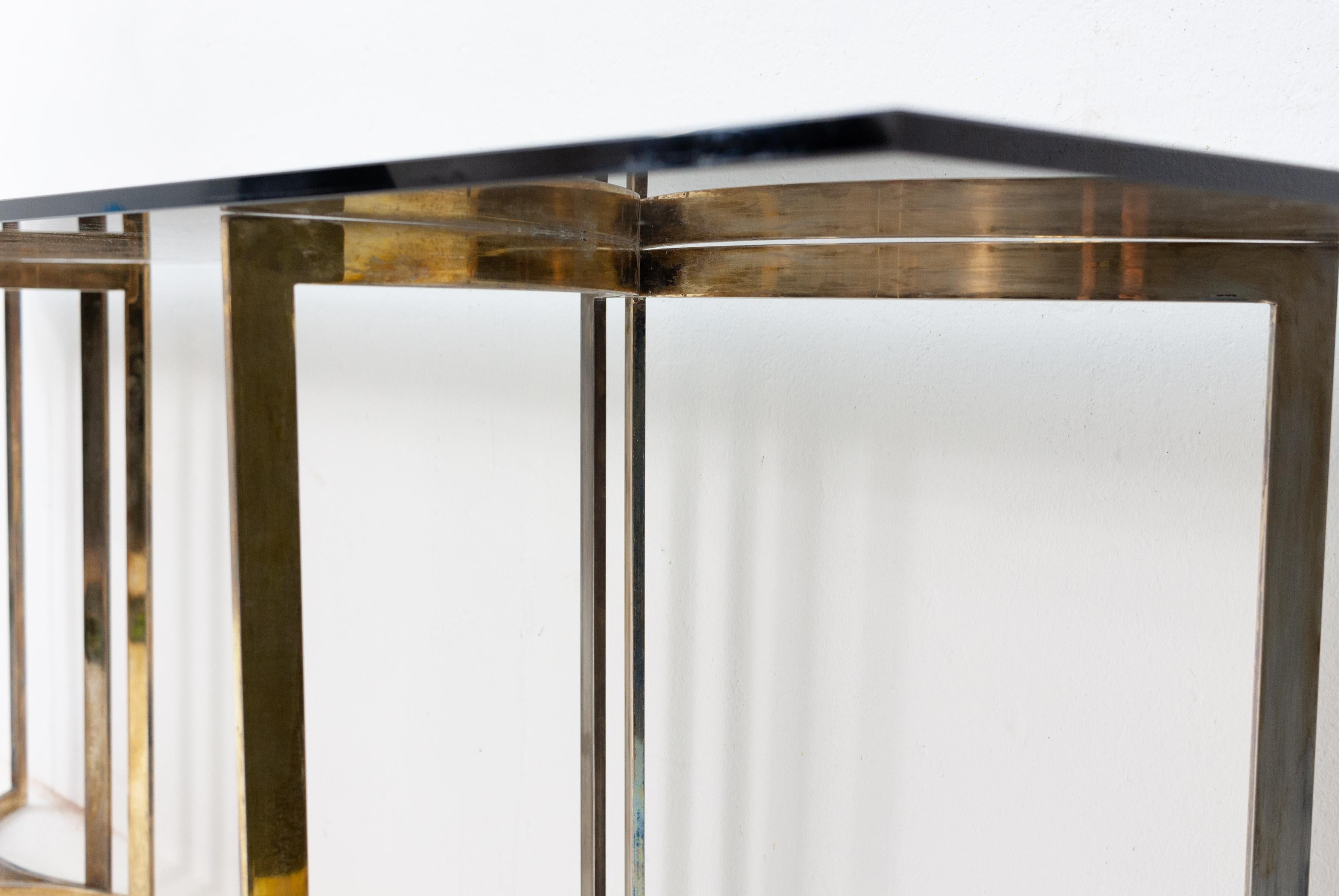 Large console table, heavy brushed steel base. Industrial looking. Comes in differed colors. Brass steel and others
With a tick smoked glass top, 1970s love it, so stylish.







    