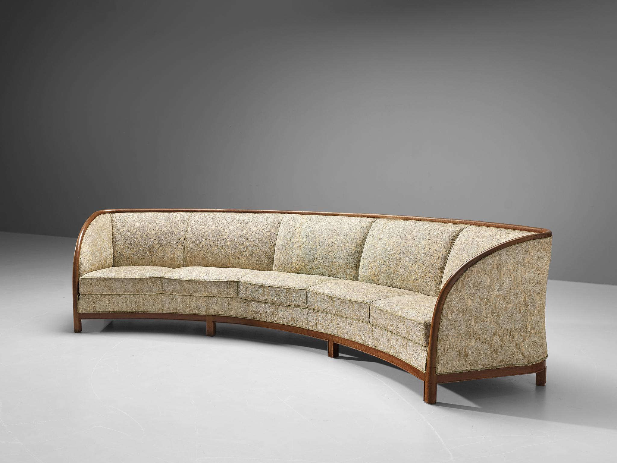 Sofa, fabric, wood, Denmark, 1950s

A grand sofa of Danish origin that radiates sophistication and understated simplicity. The curved form will bring your room a sense of dynamism. The seats are upholstered in a patterned fabric of flower motifs in