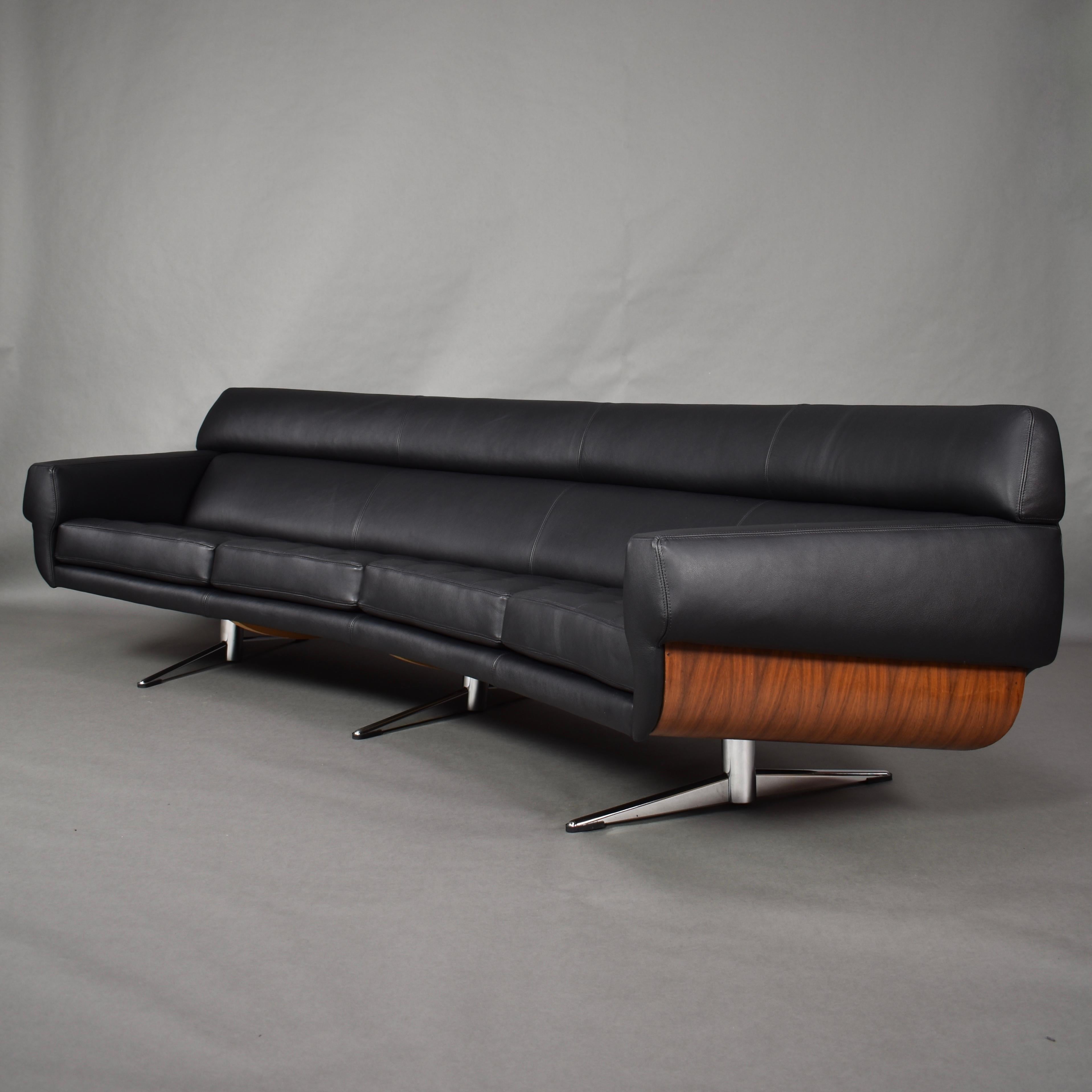 Extraordinary curved sofa by Martin Stoll, Germany, circa 1960.

This is a very rare sofa and a real showpiece!!
The sides feature beautiful walnut bent plywood in the manor of Charles and Ray Eames' lounge chair.
The sofa has been stripped to