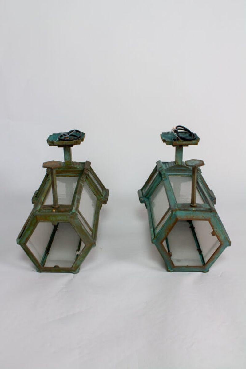 Custom bronze large exterior sconces. Deco Style. New, solid bronze, recast from a cast iron piece c. 1910. Excellent durability, bronze can hold up to years of weathering.  Photo is of a pair that is complete and ready to ship.  Please inquire