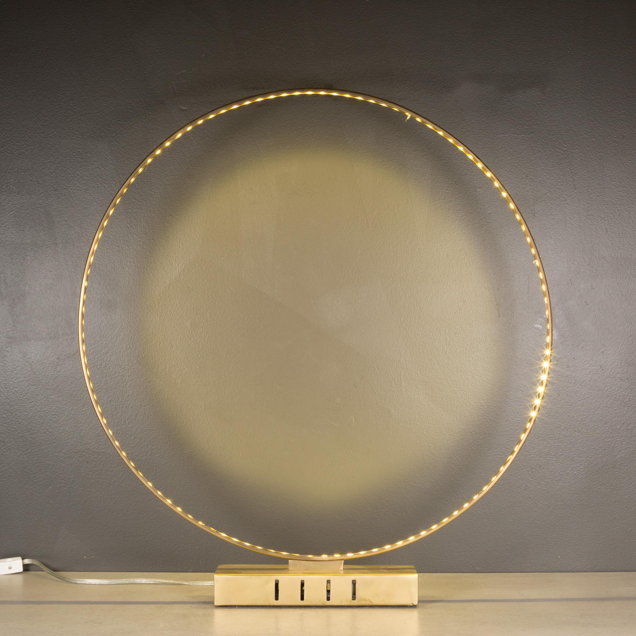 A custom circular brass plated light fixture with LED light around the circumference. 
Wiring is good. 
Lamp works properly.
26