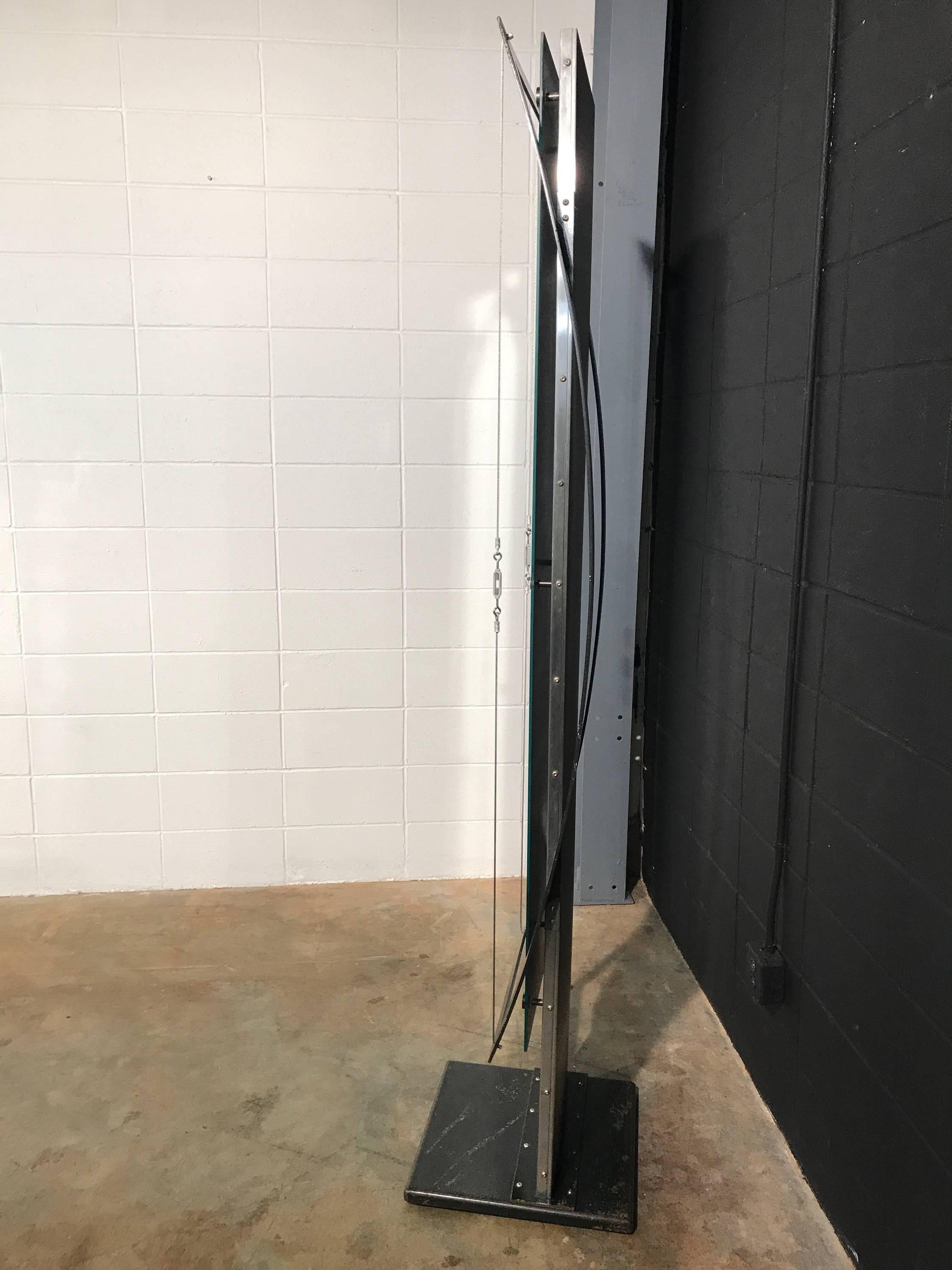 Custom curved Industrial style steel mirror. Unique mirror custom made from steel flat plate and cables. This mirror is a large statement piece and would be great for an Industrial style space, a Mid Century Modern home, or even a retail