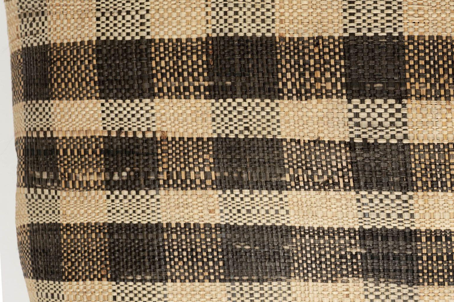 Large custom cushion from vintage African Kuba cloth. Hand-dyed and raphia palm woven in a subtle plaid pattern. Backed with brown linen. Includes zip fastener and feather insert.