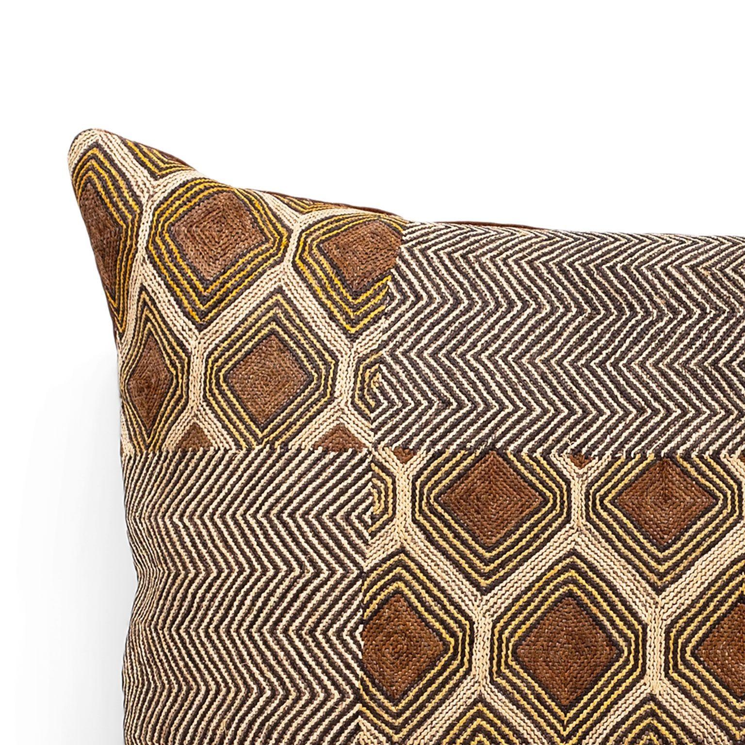Large custom cushion from vintage African Kuba cloth. Hand-dyed raphia palm handwoven in an intricate pattern. Backed by brown velvet. Includes zip fastener and feather insert.