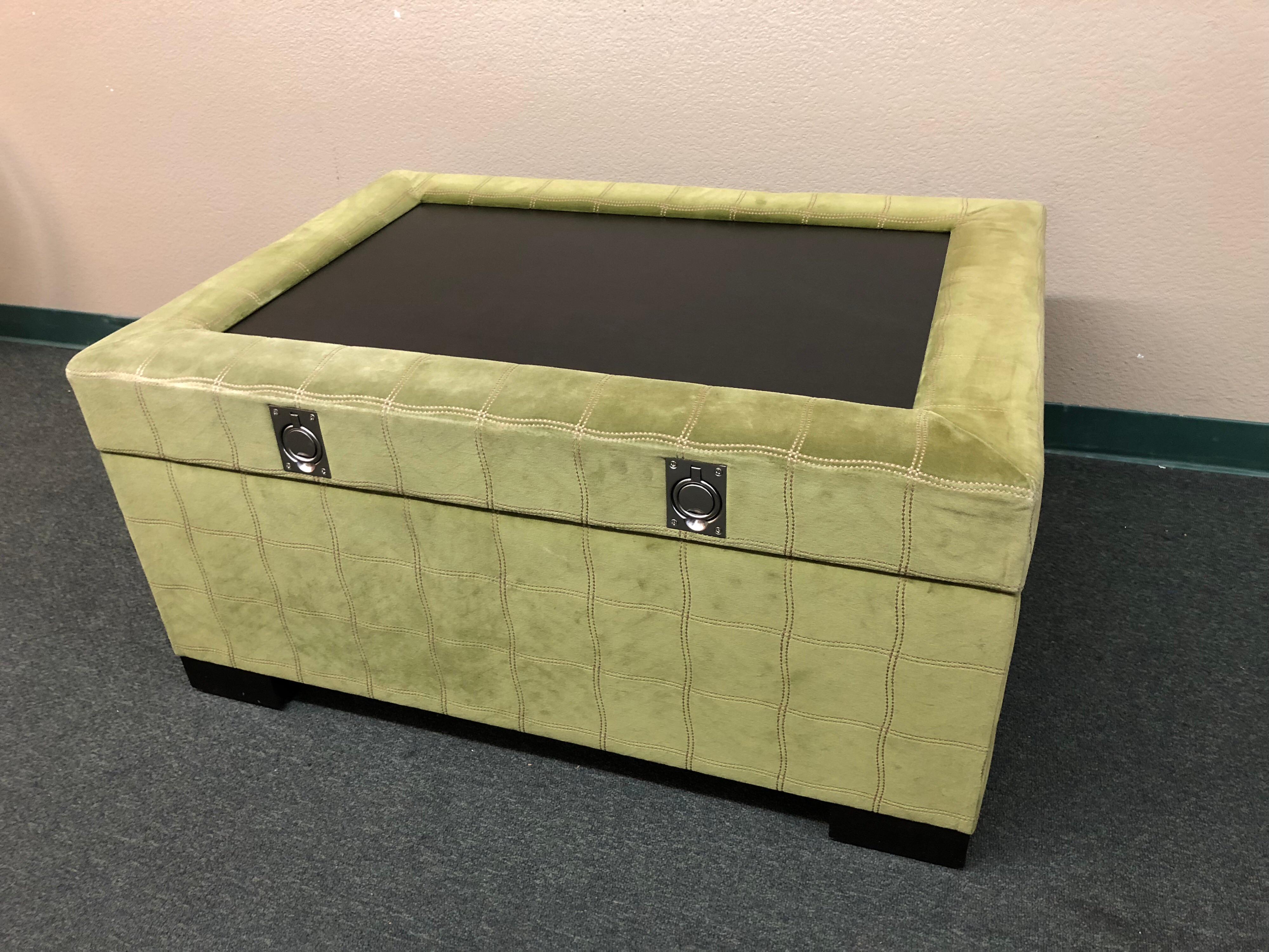 Design Plus Gallery presents an oversized ottoman, upholstered in Osborne & Little velour. Overstitched in a plaid design for a touch of detail, the large piece offers ample storage as well as display or serving area on lid. Brushed stainless