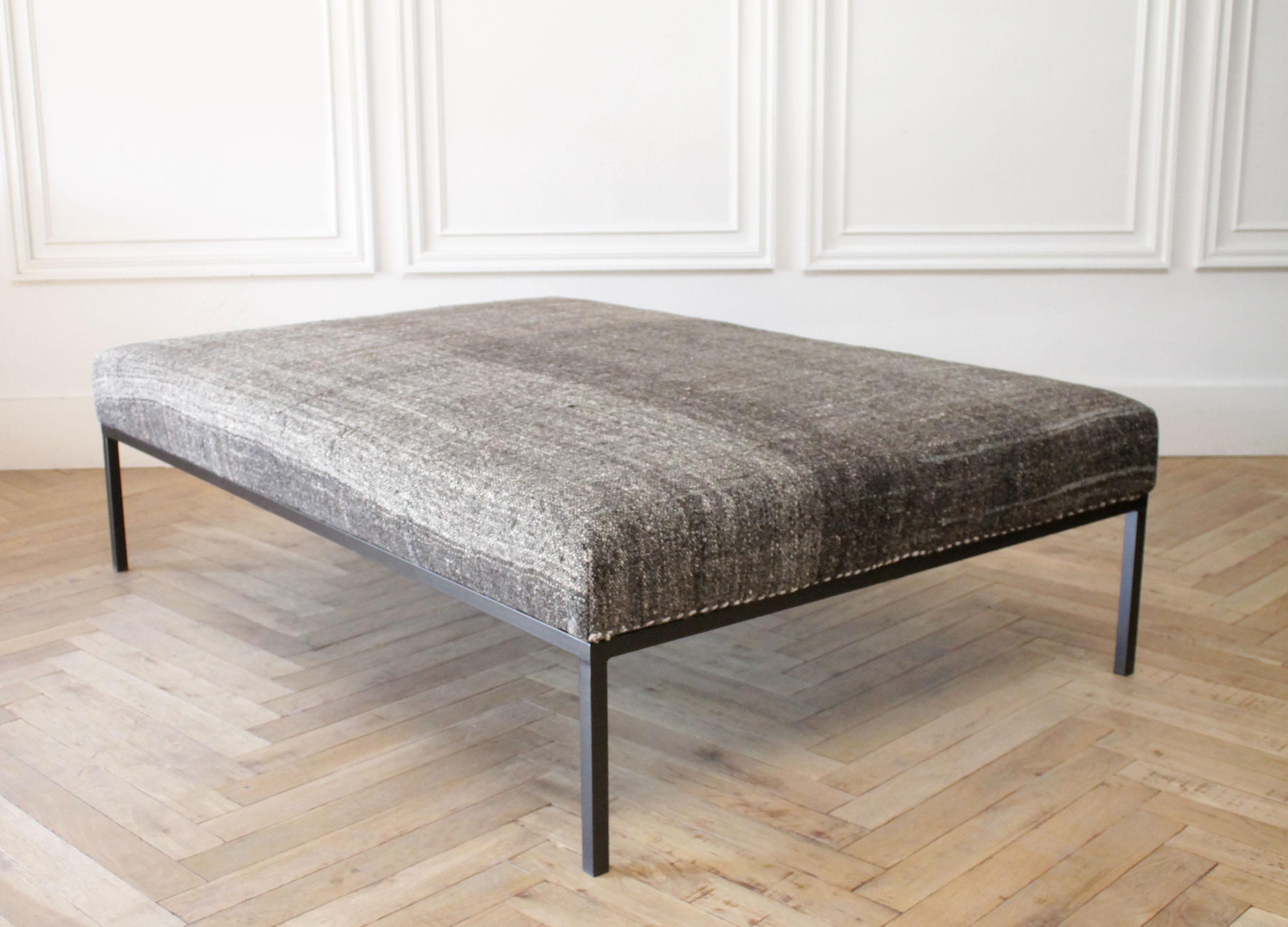 Large custom iron cocktail table ottoman upholstered in a vintage Turkish rug
We offer custom sizes if you are looking for something specific.
This ottoman is as shown, upholstered in a beautiful coco brown, gray and creamy white woven vintage