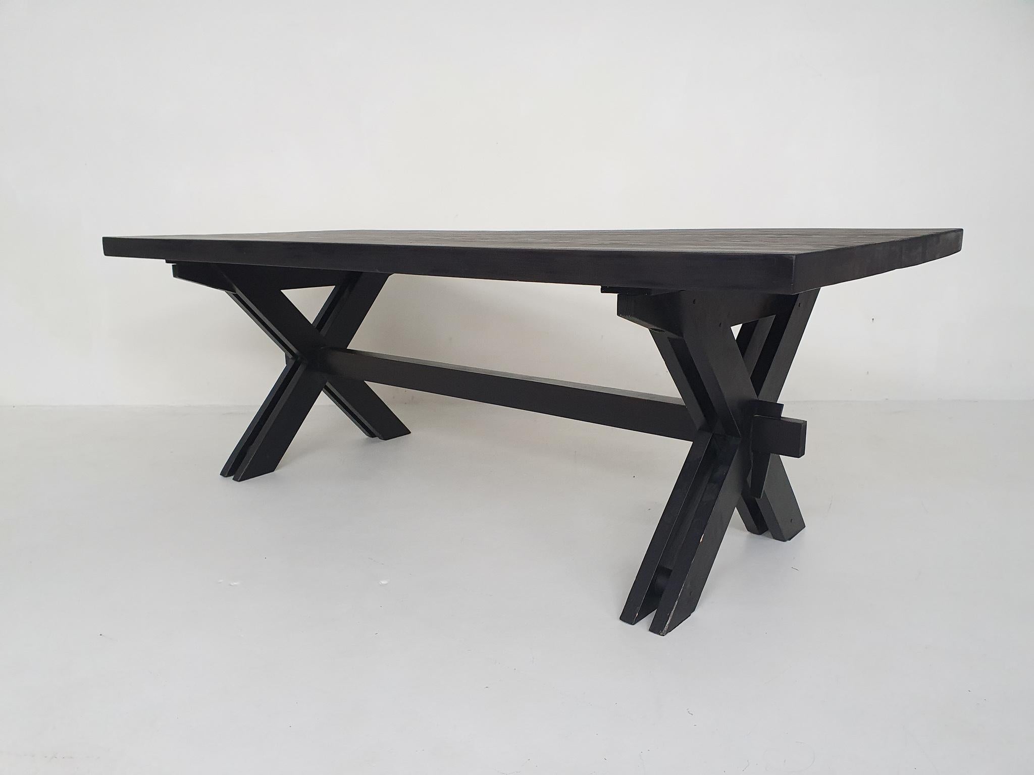 Large black laquered wooden table (probably pinewood). This table was desgined by an (unknown) architect for a villa in Germany in the 1970's. The table was custom made by Johannes Blesgen.
The table has a nice crossed legs frame, and a very heavy