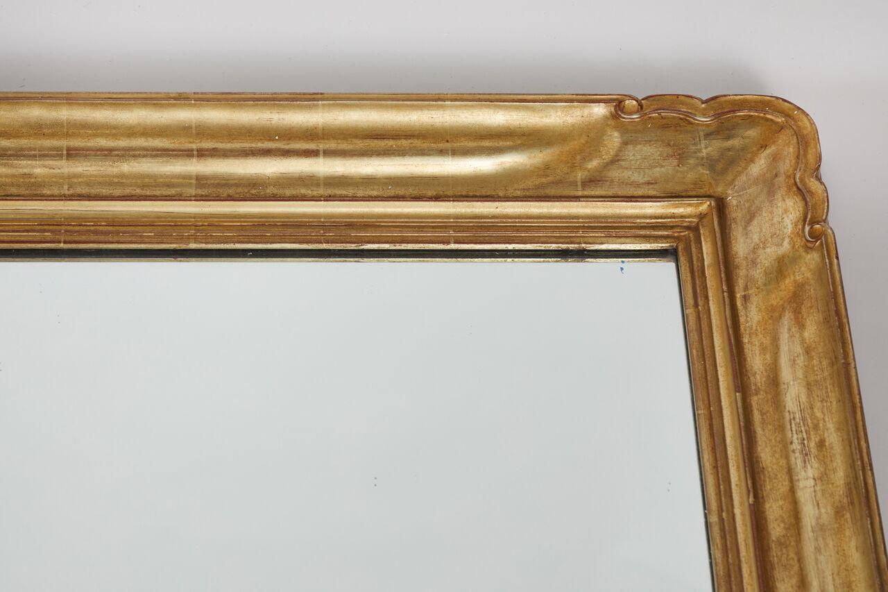 Large stunning custom giltwood framed mirror, hand-carved. At over 7' high, this mirror makes quite the statement.
Clean lines with elegant details at the corners lend a transitional feel to this mirror.
