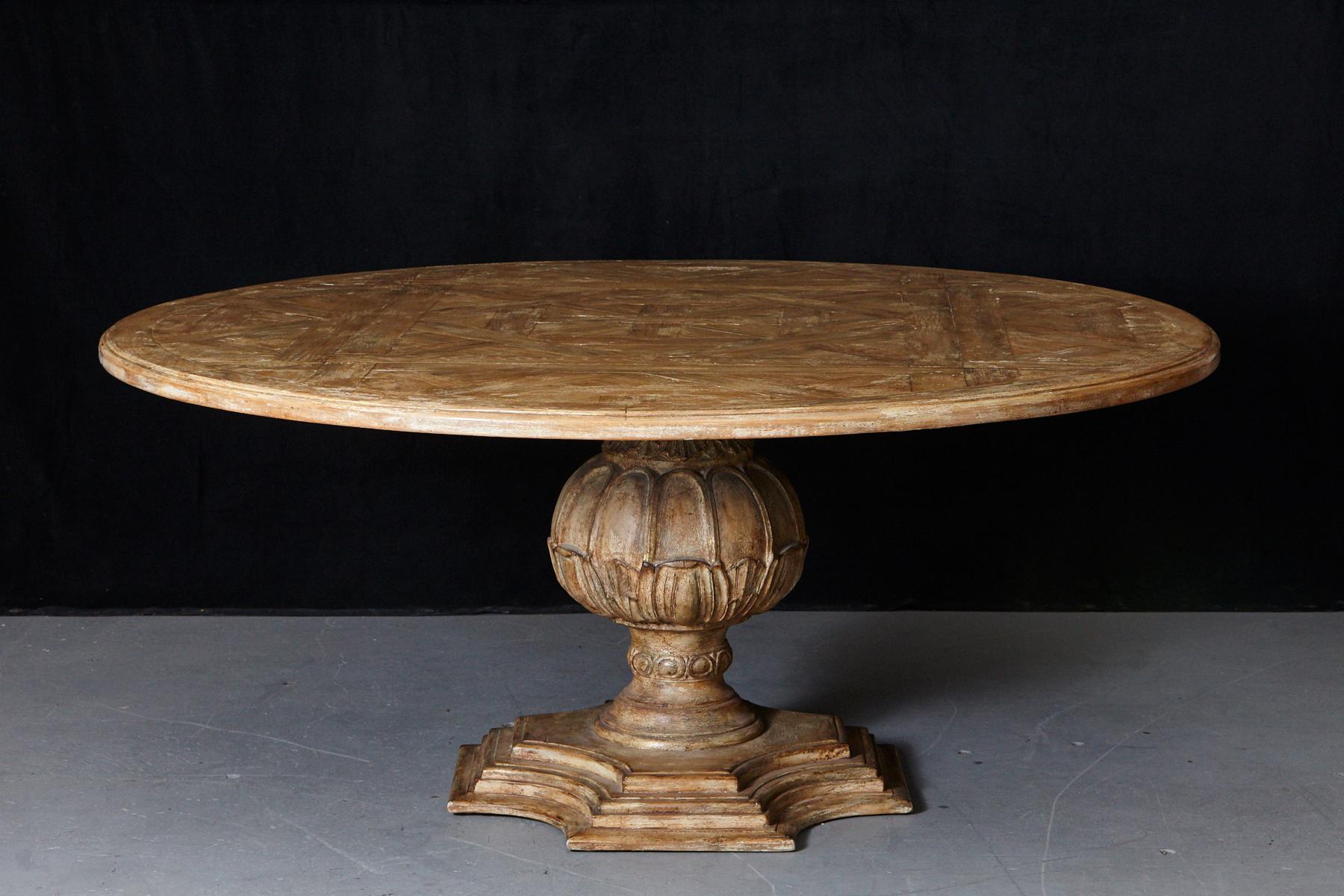 Large custom made and paint decorated round top baluster dining table with parquet top.
Voluntarily distressed look, some little paint loss to the top, please refer to the detailed photos.
A very solid table, can also be used as a centrepiece in