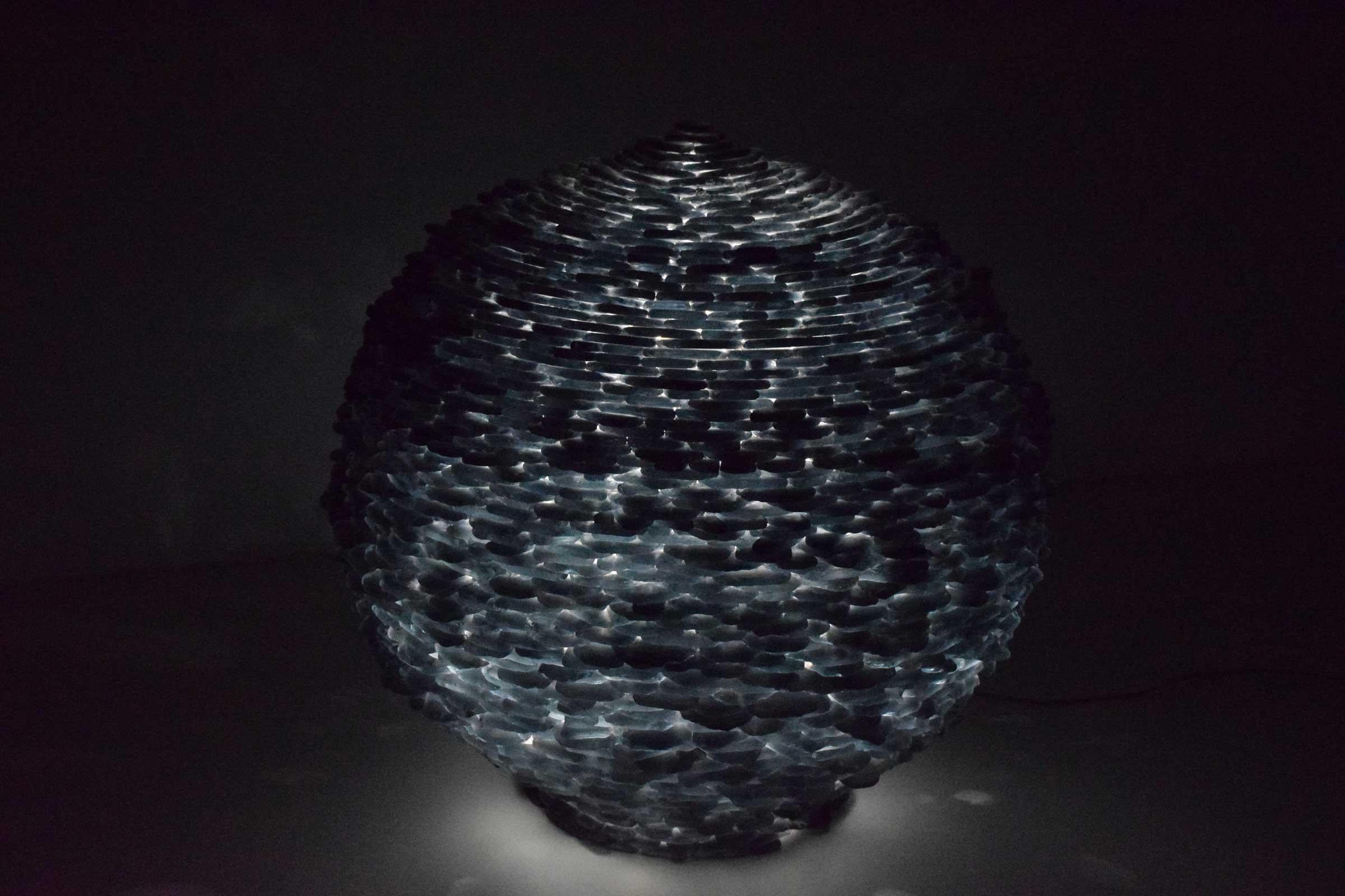 This is a really great lamp. It has hundreds of pieces of cut glass forming a round ball like lamp. Lamp can sit on floor or top of table or pedestal. A true work of art. Especially beautiful when lit at night, a soft, textured glow. In the manner