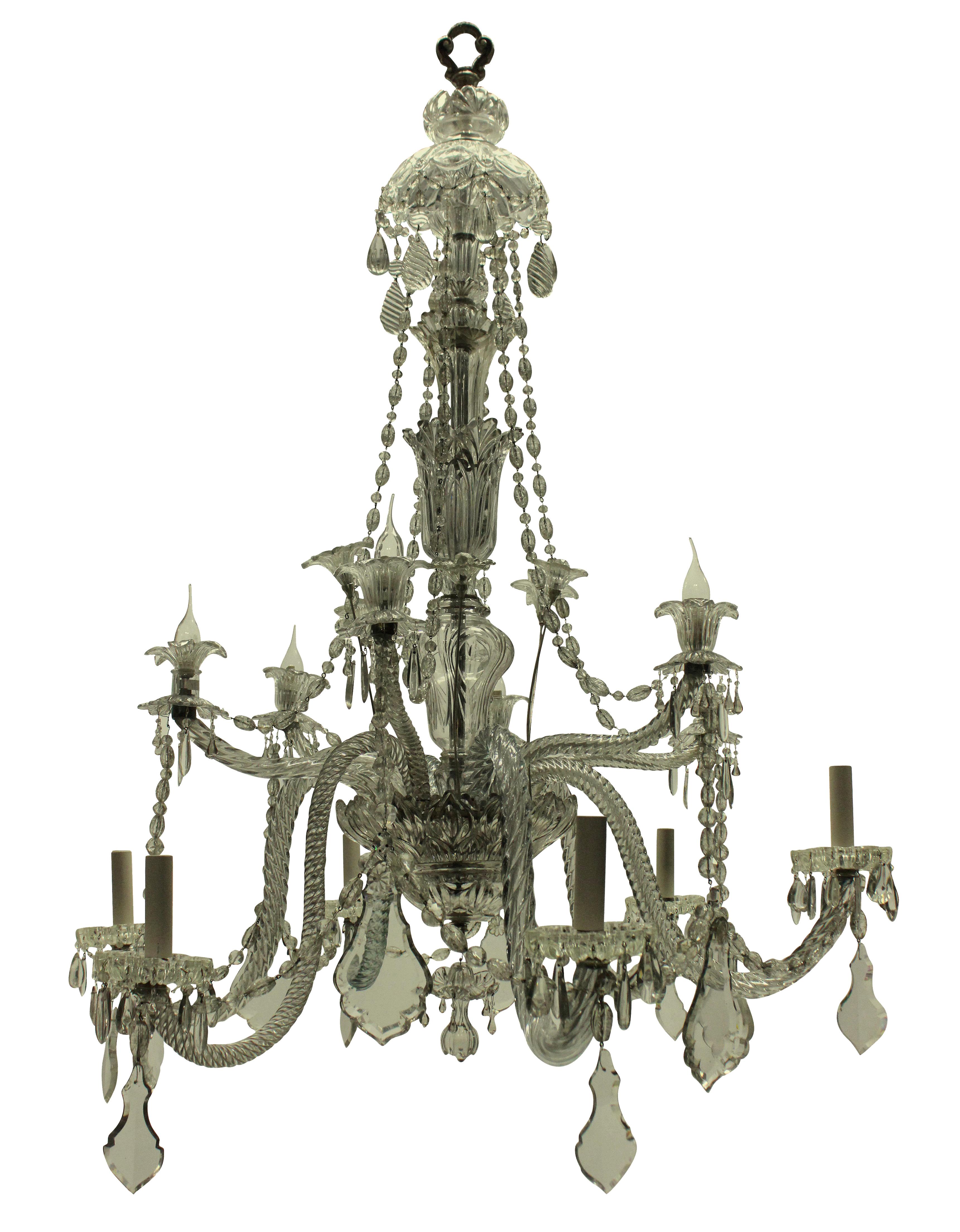 A large French chandelier by Baccarat, of twelve arms and profusely hung with foliate detail.
