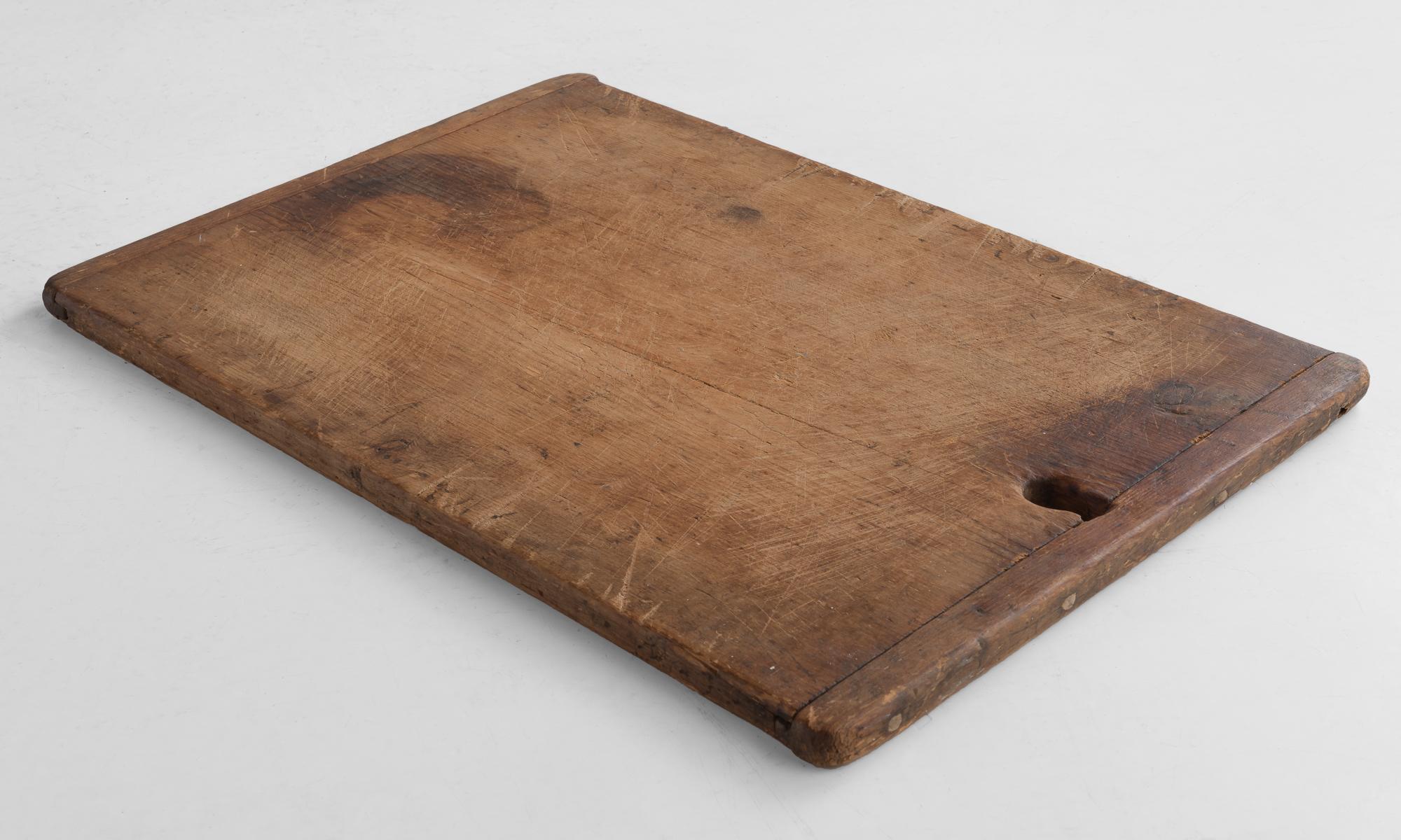 Large cutting board, circa 1900

Double sided, beautifully worn Primitive form with slated end construction.