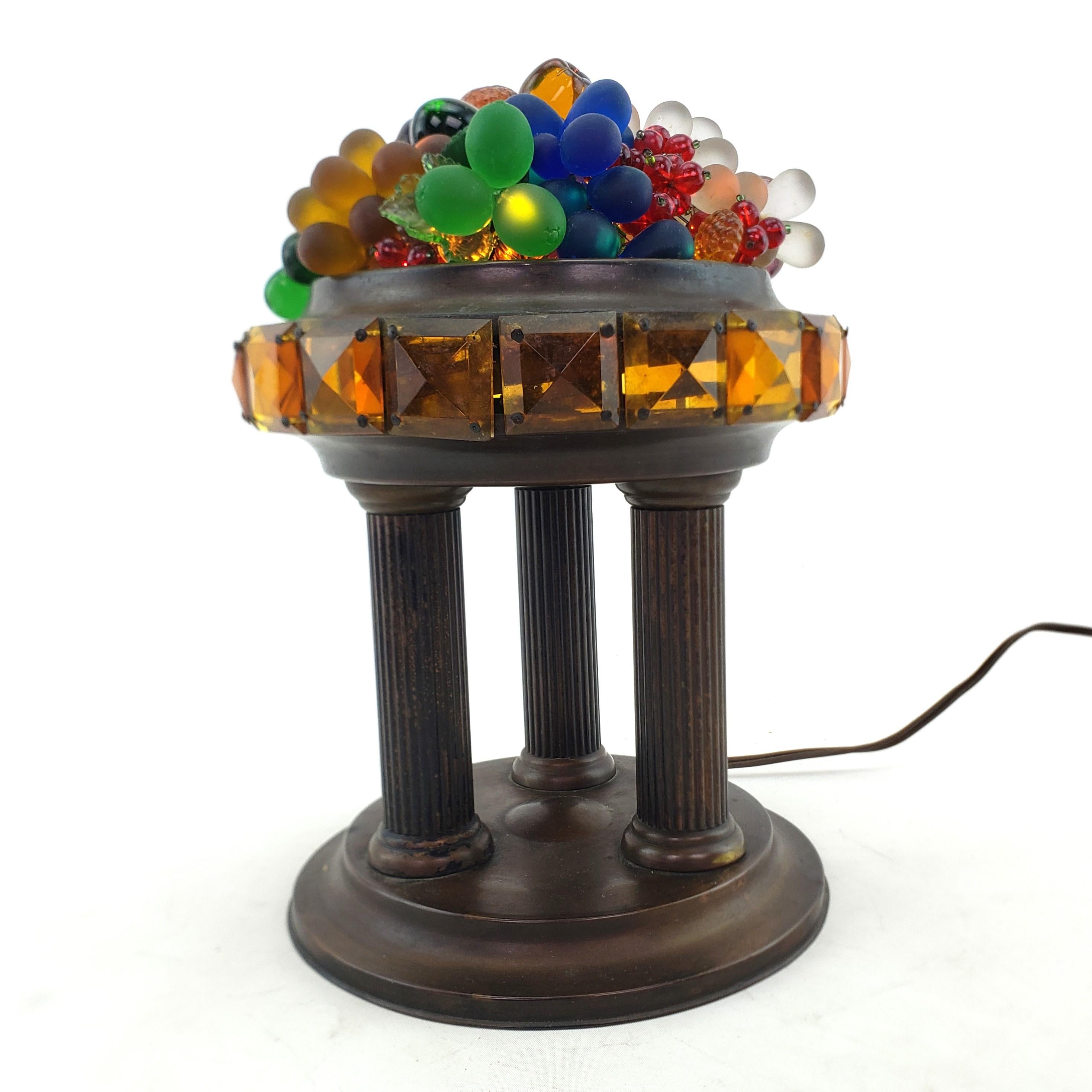This vintage accent table light is unsigned with respect to the maker, but presumed to have originated from the Czech Republic and date to approximately 1960 and done in a classical style. The lamp shade is composed of a series of molded and