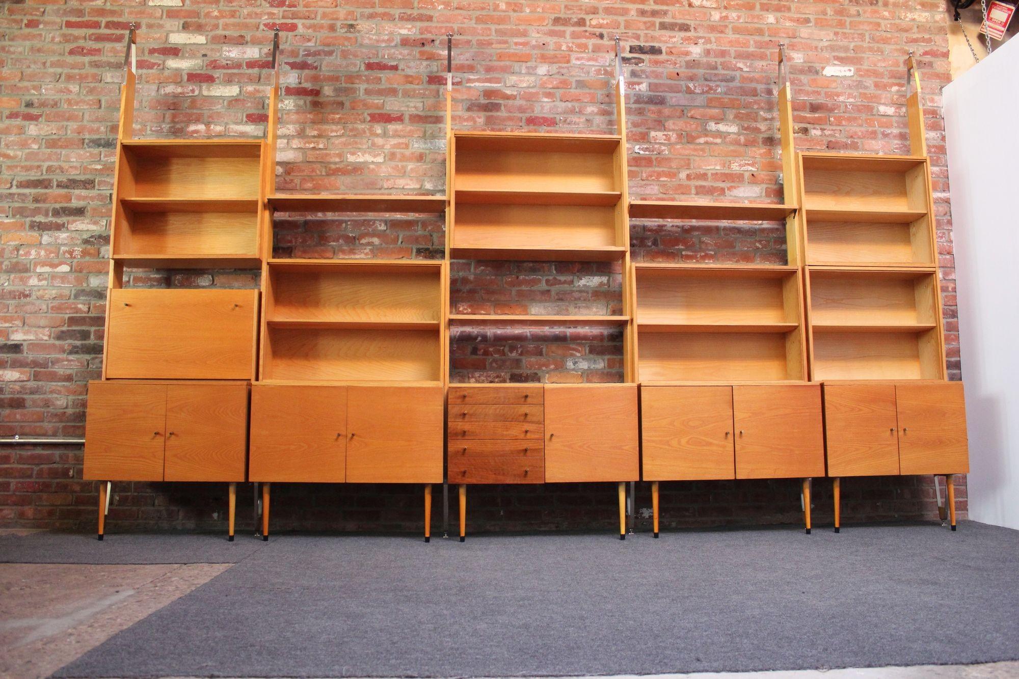 Versatile freestanding wall-unit/bookcase in oak, walnut, and pine with aluminum, steel, and brass accents by Jitona (1968, Lomnice nad Lužnicí, Czechoslovakia). 
Five bays can be assembled in total if all pieces are utilized together - seven pine