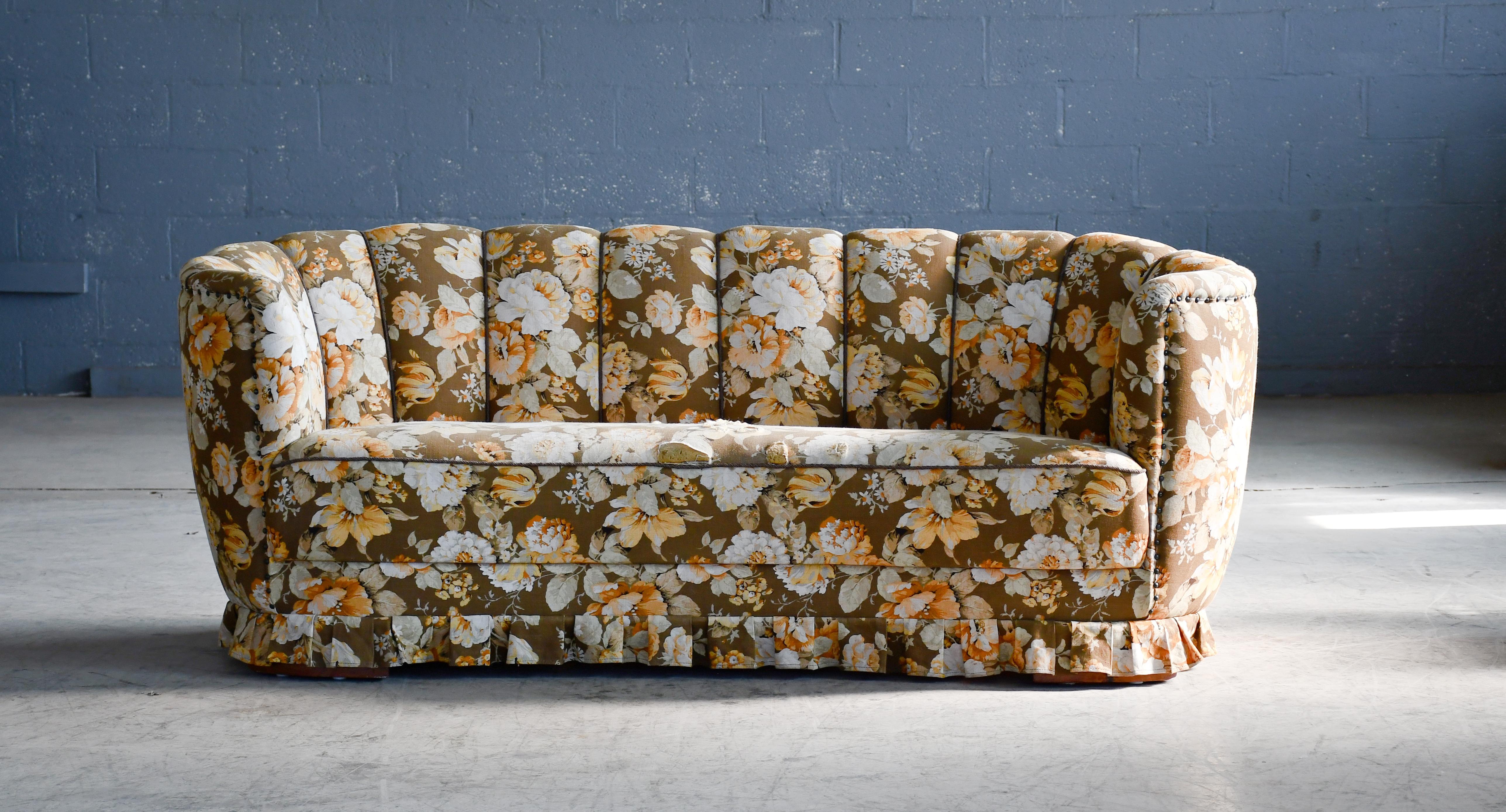 Banana shaped Viggo Boesen style curved sofa made in Denmark in the 1940s. This sofa will make a strong statement in any room. Beautiful round organic lines and iconic block feet feet normally associated with Viggo Boesen. Solid and sturdy. The