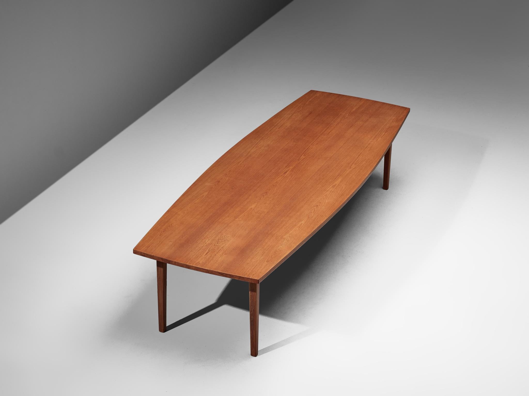 Conference table, in teak and beech, Denmark, 1950s.

A 3.6mtr/140in large dining table in teak. The boat-shaped tabletop is made out of one piece, featuring a beautiful grain. The base consists of eight conical legs and shows beautiful straight