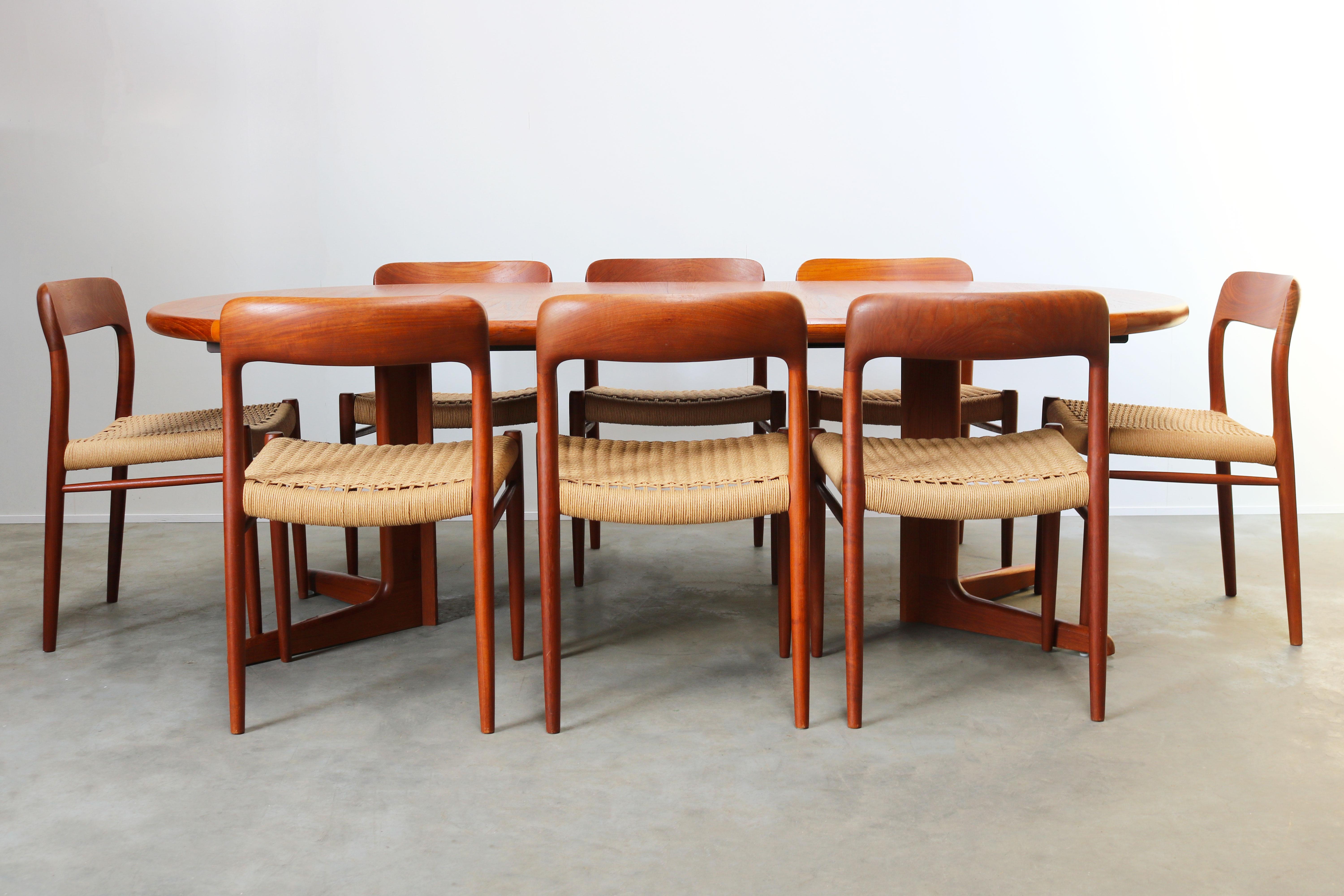 Very large and rare dining room set designed by Niels Otto Møller and produced by J.L Mollers in the 1950s. The set has eight Model 75 chairs in teak and papercord. And a large round (twice extendable) table in teak.
The table can be used round for