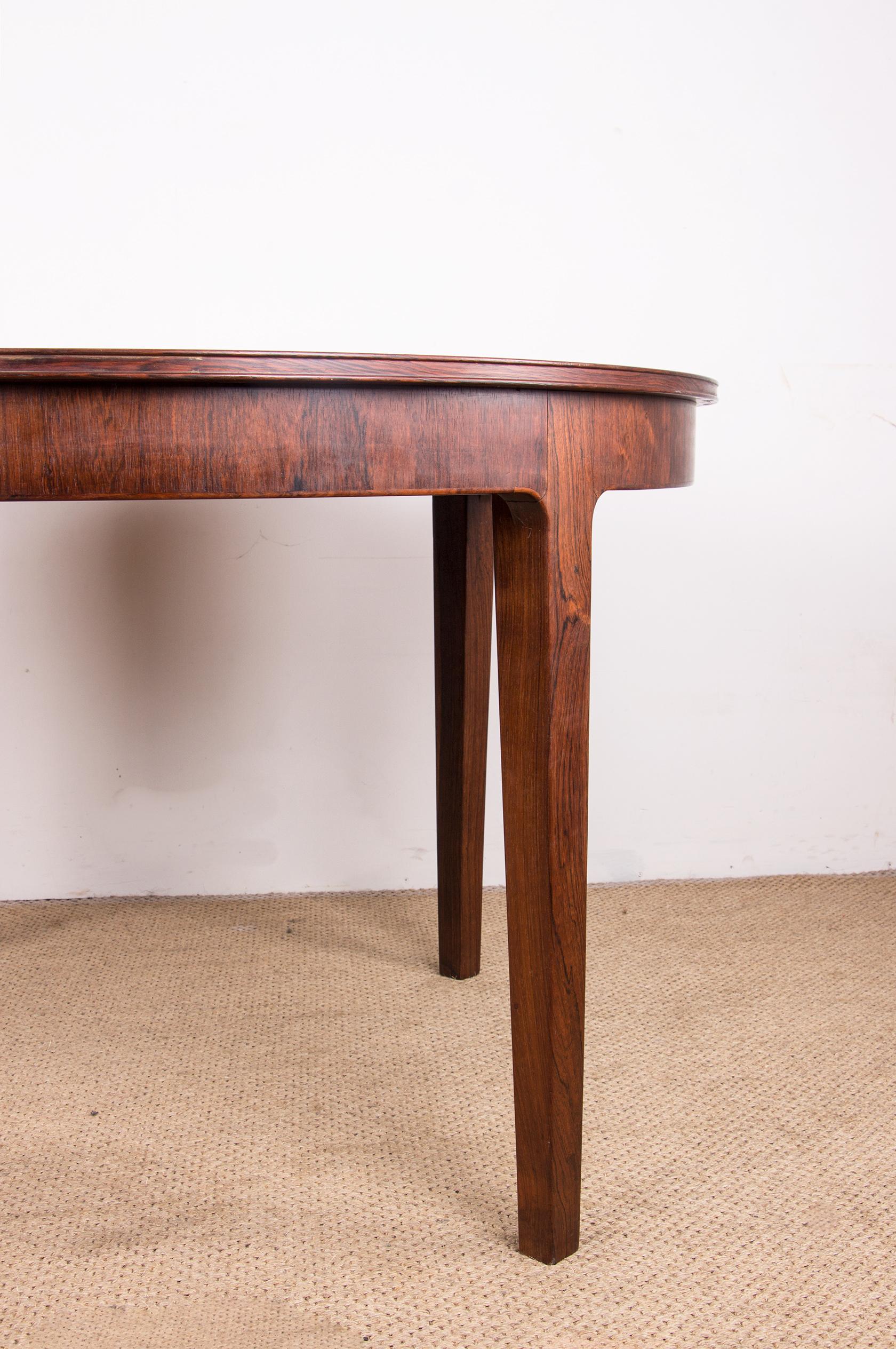 Scandinavian Modern Large Danish extendable dining table in Rosewood by Hugo Frandsen for Spottrup. For Sale