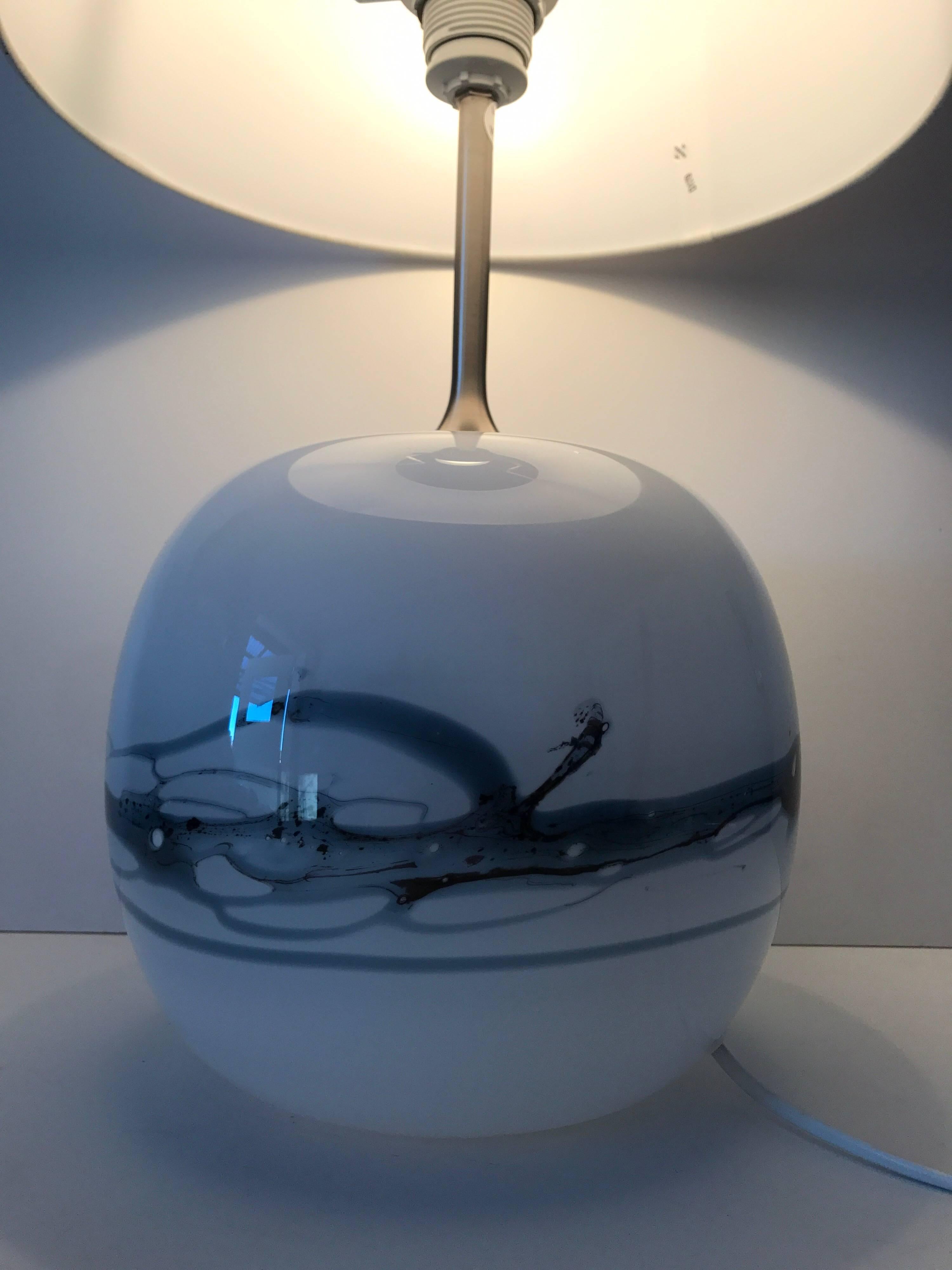 Large Danish glass table lamp Sakura for Holmegaard by Michael Bang.
A very beautiful blue-white glass table lamp by Michael Bang, this model is called Sakura.
The dimensions of the lamp is 58 cm in height and the diameter of the glass base is 24