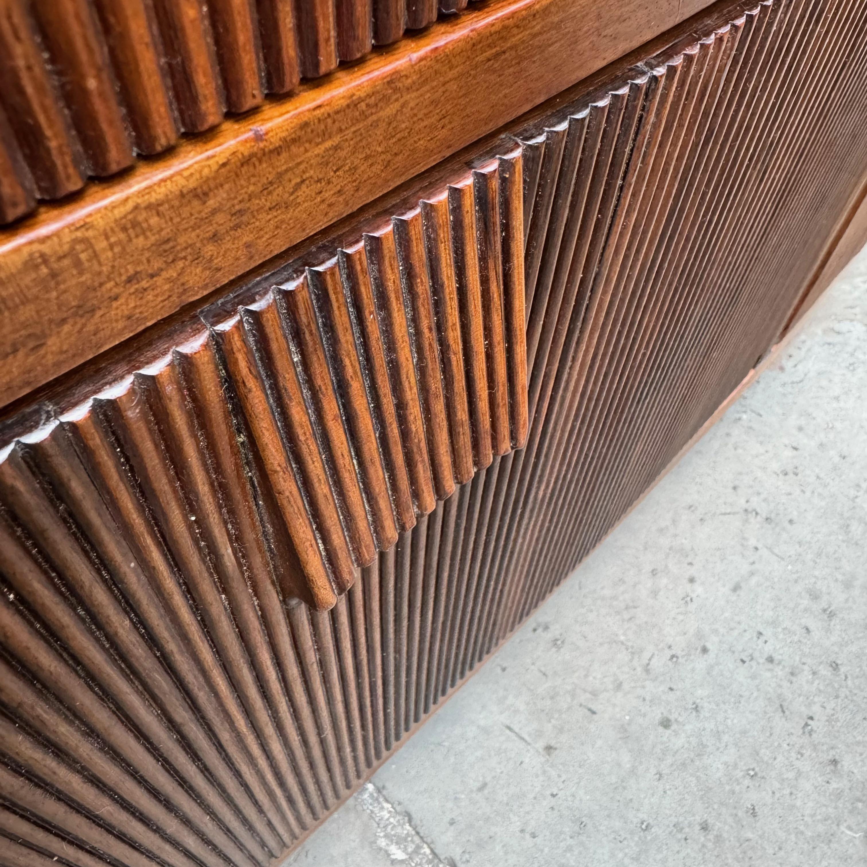 Originally retailed at Illums Bolighus, Copenhagen's most prestigious department store, this large Danish mahogany cabinet references 18th-century British design. Specifically, the gentle bowing shape in the front of the cabinet and the incised