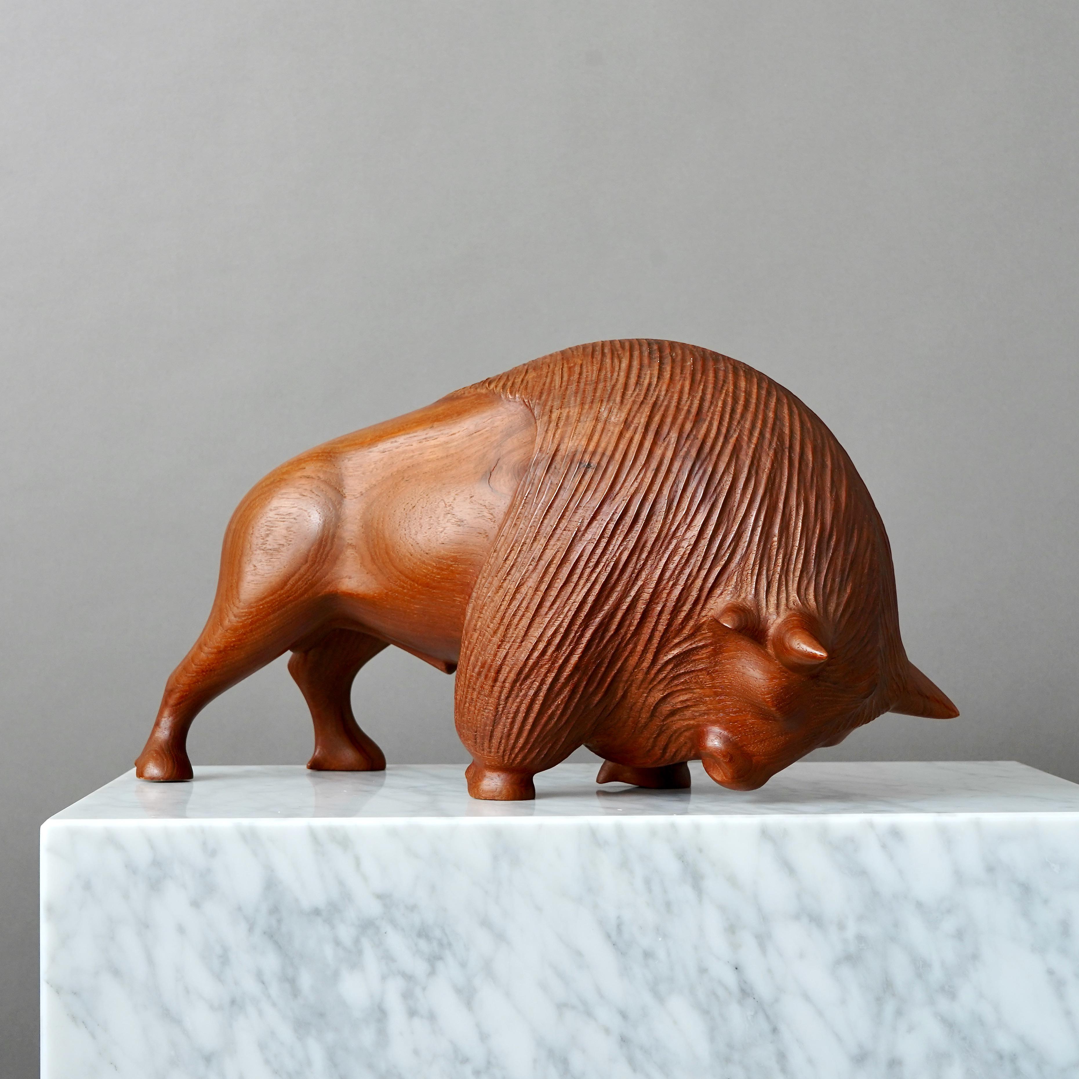 A stunning Danish mid-century carved teakwood bison.
Reportedly purchased from Den Permanente, Copenhagen, in the early 1950s.

Excellent condition.

Den Permanente was a Co-operative institution for the exhibition of furniture, design and