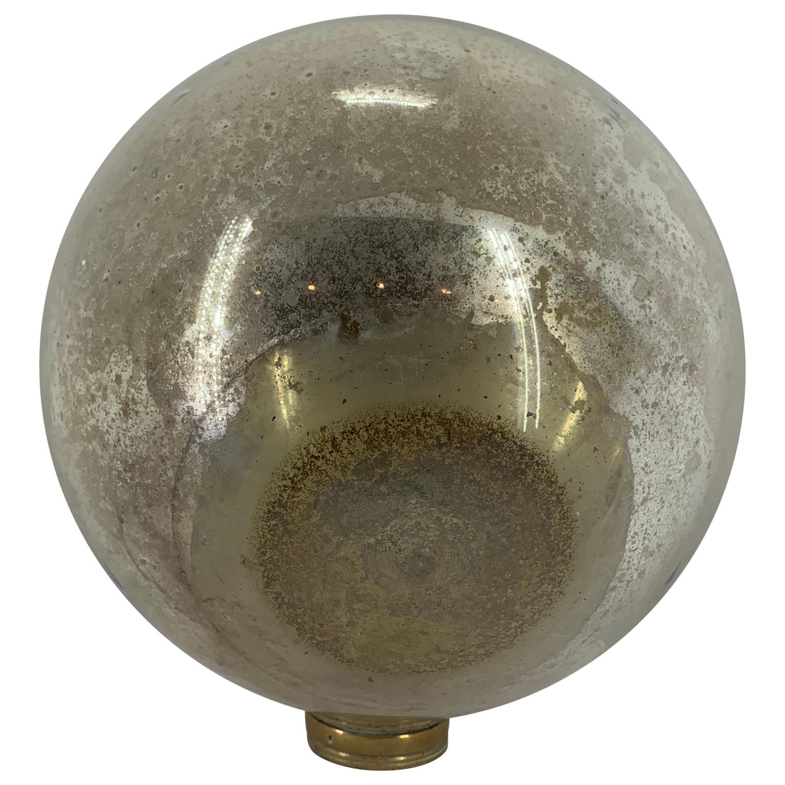 Large Danish decorative mirror ball with brass hardware.