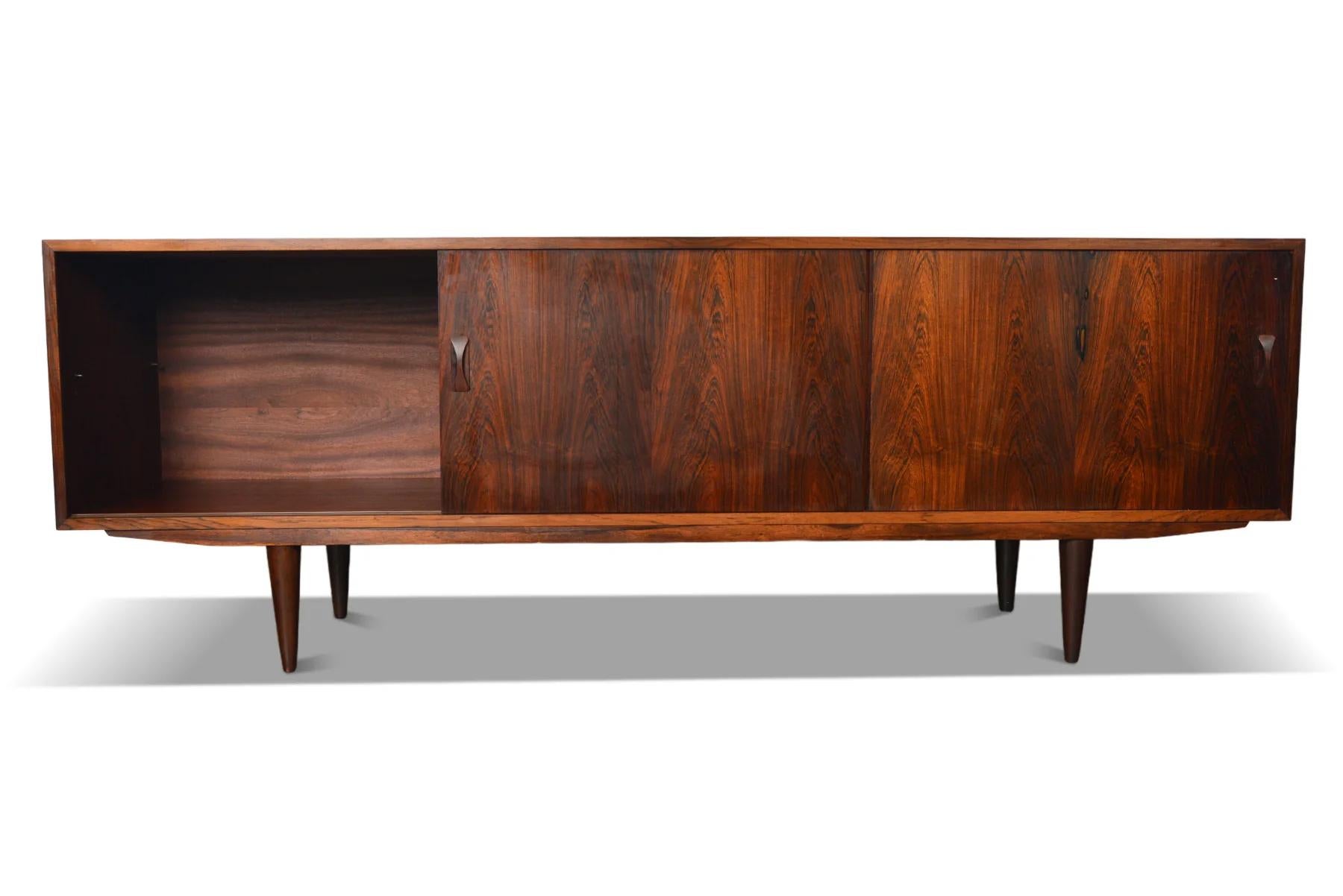 Origin: Denmark
Designer: Unknown
Manufacturer: Clausen & Søn
Era: 1960s
Materials: Rosewood
Measurements: 82″ wide x 17.5″ deep x 29″ tall

Condition: In excellent original condition with typical wear for its vintage. Price includes restoration /