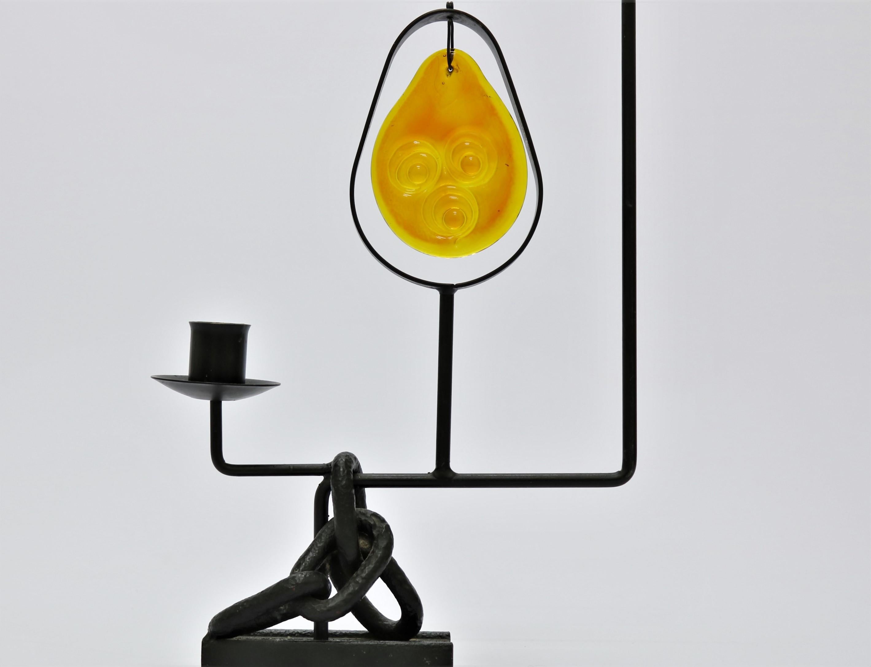 Unique piece of Brutalist style wrought iron floor sculpture with candleholder and beautiful orange suncatcher in thick handblown glass by Holmegaard Glasvaerk, Copenhagen. This piece of Brutalist Art was made in Denmark in the 1960s and bears