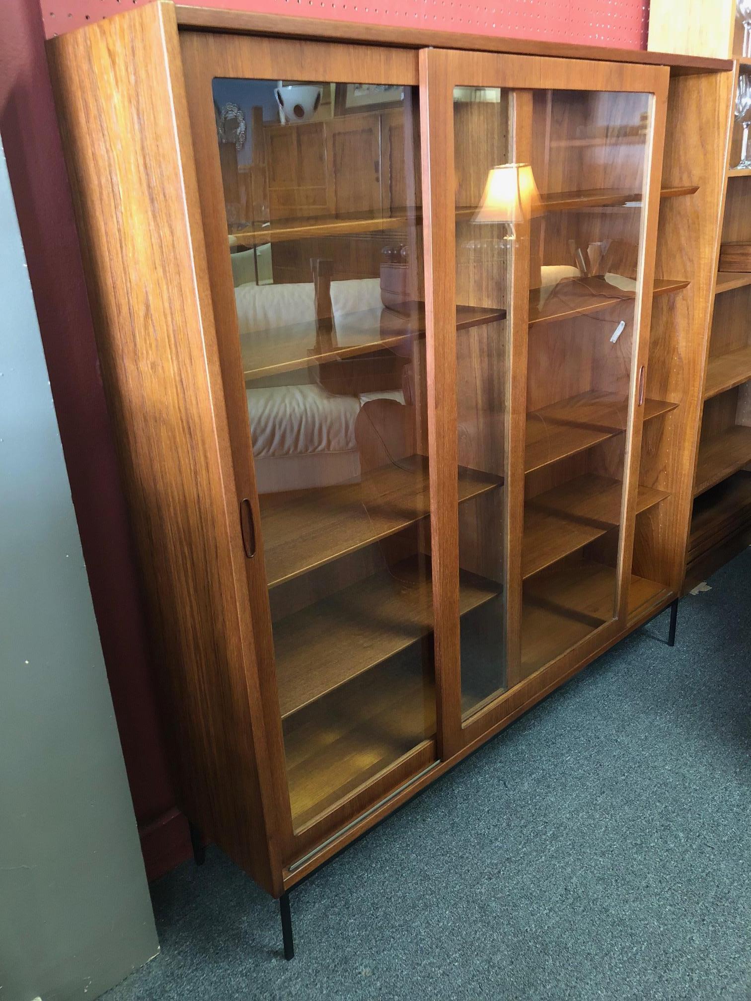 Large Danish Modern Teak Bookcase with Sliding Glass Doors on Iron Base In Good Condition In San Diego, CA