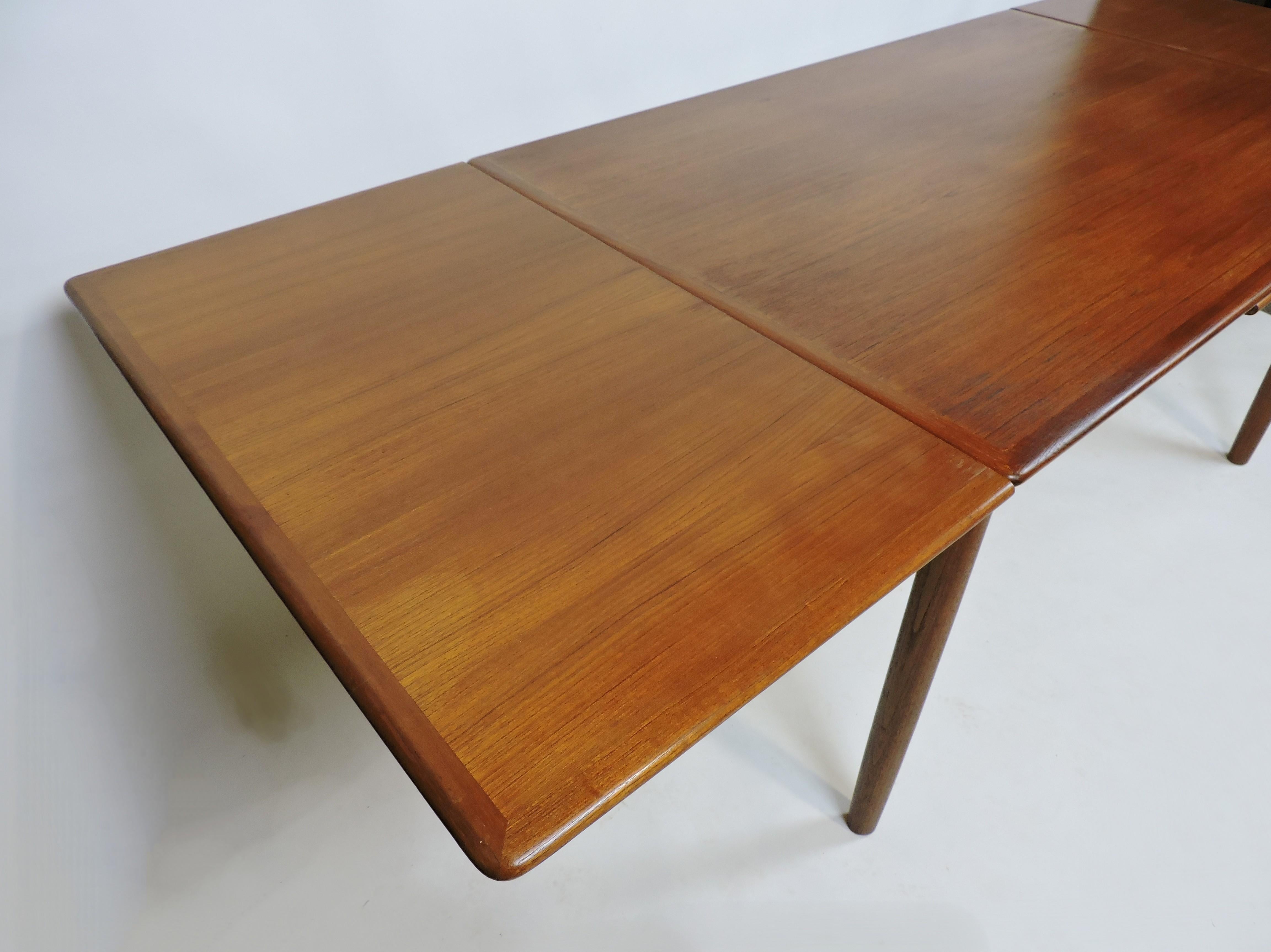 Mid-20th Century Large Danish Modern Teak Extendable Dining Table with Self-Storing Leaves