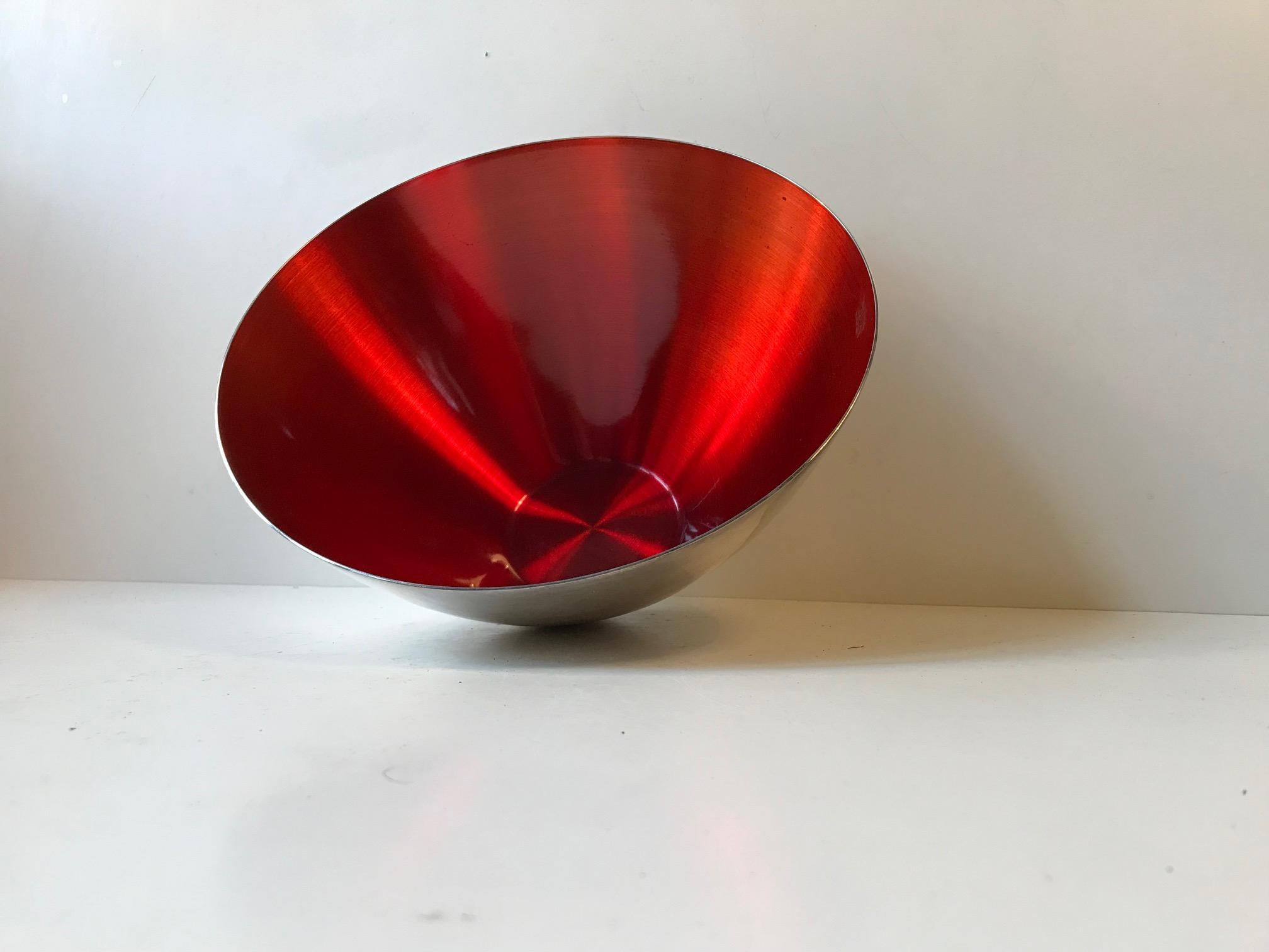 This large conical silver plate bowl's interior is decorated with a deep ruby red enamel. The piece was manufactured and designed in Denmark during the late 1950s by DGS (Danish Silver- & Goldsmith association). This is the largest bowl in the