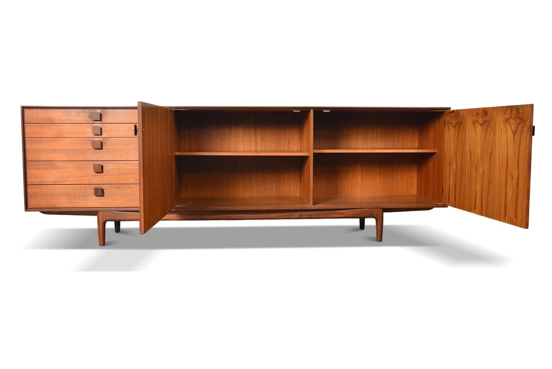 Origin: Denmark
Designer: Ib Kofod Larsen
Manufacturer: G Plan
Era: 1961
Materials: Teak, Afromosia
Measurements: 92.5″ wide x 19.5″ deep x 30″ tall

Condition: In excellent original condition with typical wear for its vintage. Price includes a full