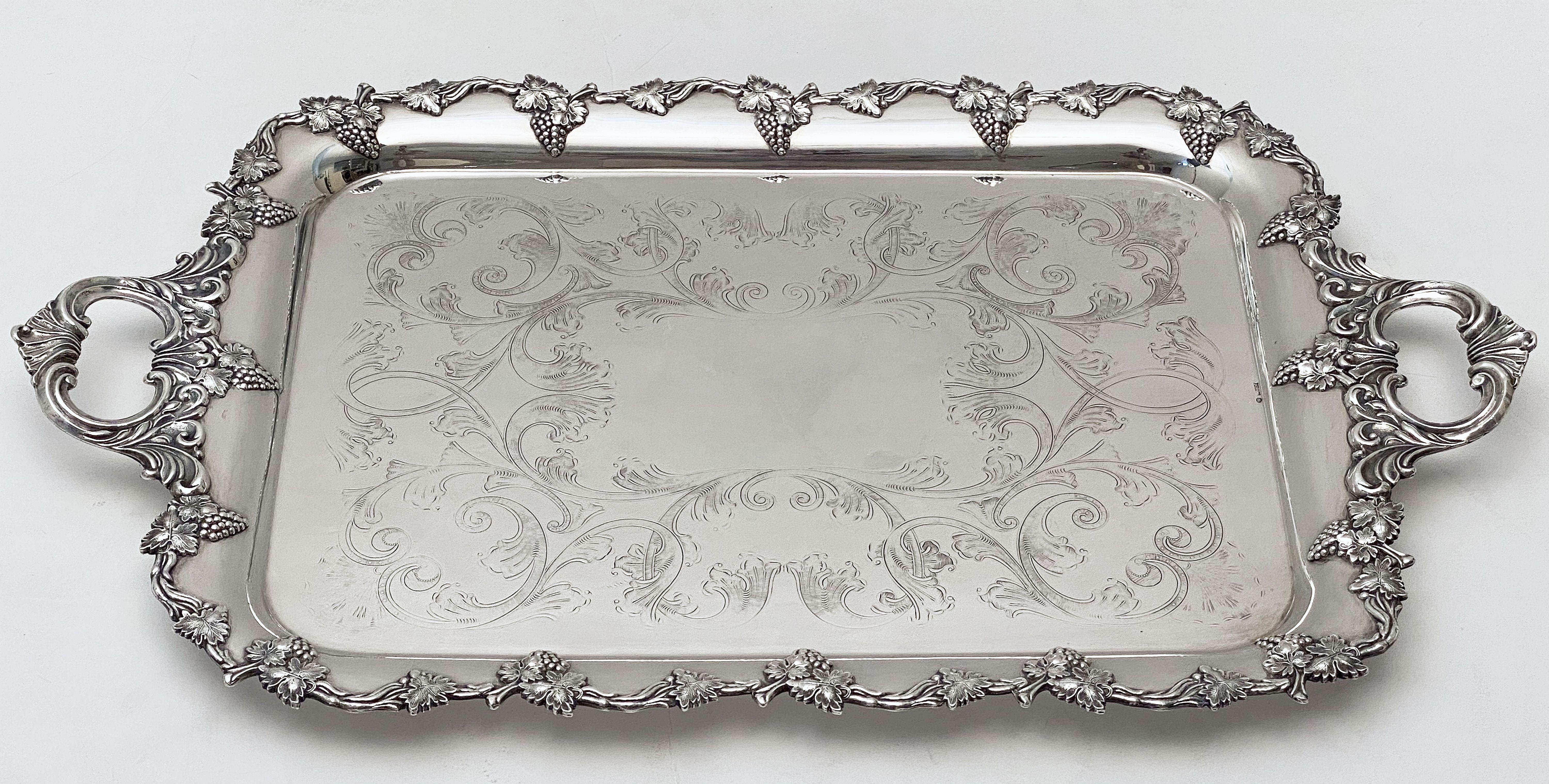 A handsome Danish rectangular serving or drinks tray of fine plate silver, by the celebrated silversmiths, F. Bloch, featuring two opposing handles and a stylish pattern of grape clusters and leaves around the circumference, with an etched