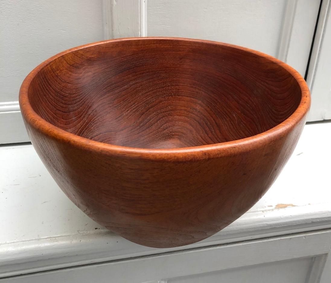 Mid Century Large Danish Teak Sculptural Wooden Bowl, circa 1960

Stunning sculptural Danish teak large bowl. Wider at top rim, graduating down to a smaller base.
Beautiful patina. Would make great fruit bowl, or just as is! In excellent