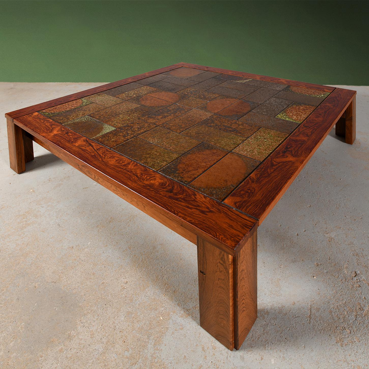 Large coffee table in solid wood and ceramic tiles in the style of Tue Poulsen. This coffee table can be used with or without castors. They are very easy to insert under the legs or remove as you wish. This table is a Danish piece from the 1960s/70s