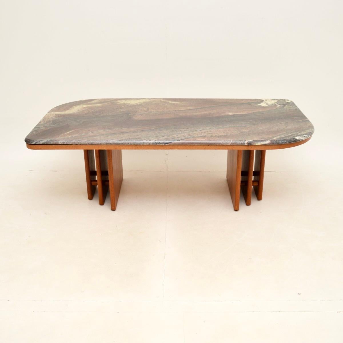 An absolutely stunning and very impressive large Danish vintage marble top coffee table, dating from the 1970’s.

The quality is outstanding, this has a beautifully shaped marble top with gorgeous colours. The base is teak, with a very interesting