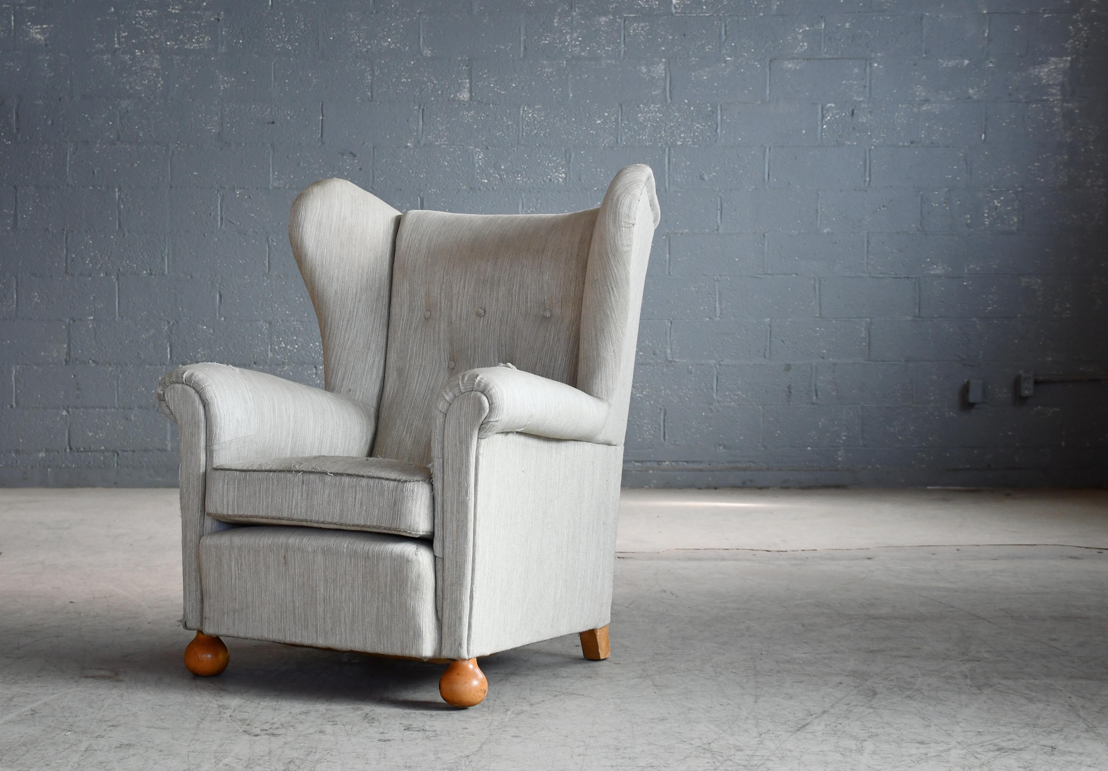 Scandinavian Modern Large Danish Wingback Armchair with Bun Feet 1940's For Sale