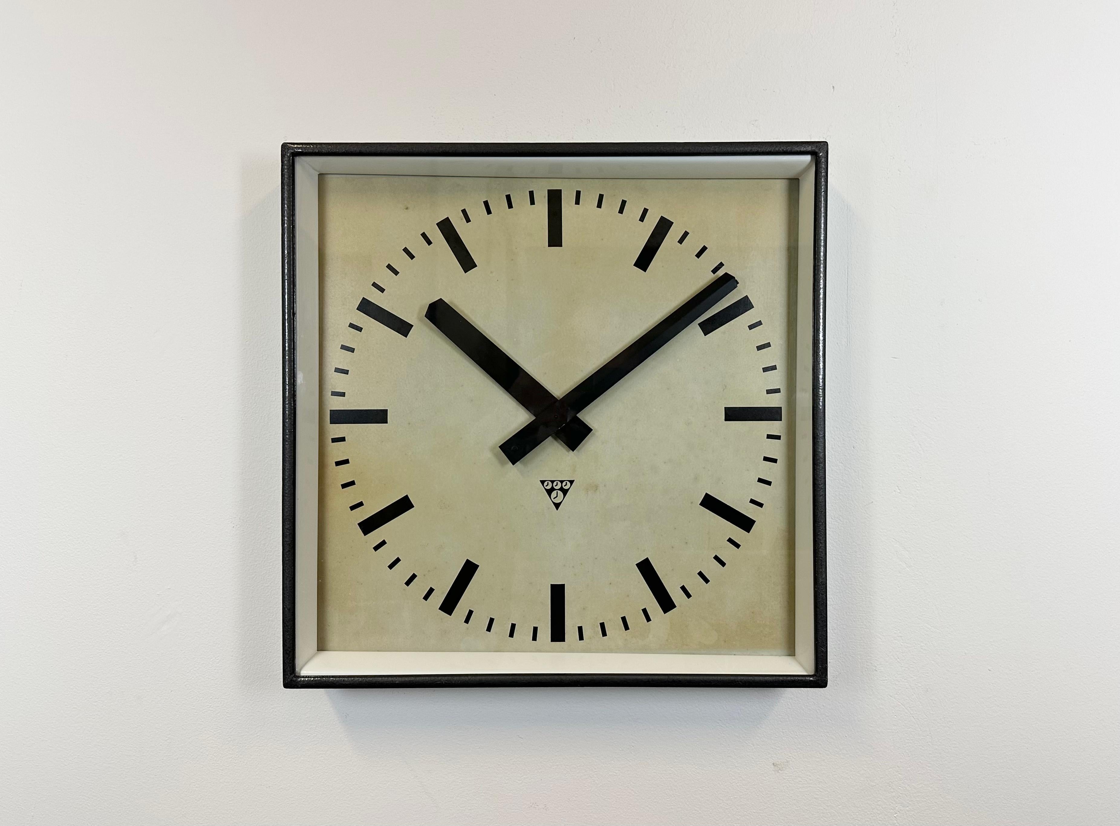 - Clock made by Pragotron in former Czechoslovakia during the 1960s.
- Was used in factories, schools & railway stations.
- Features a dark gray hammer paint finish iron body, metal dial, clear glass.
- Has been converted into a battery-powered
