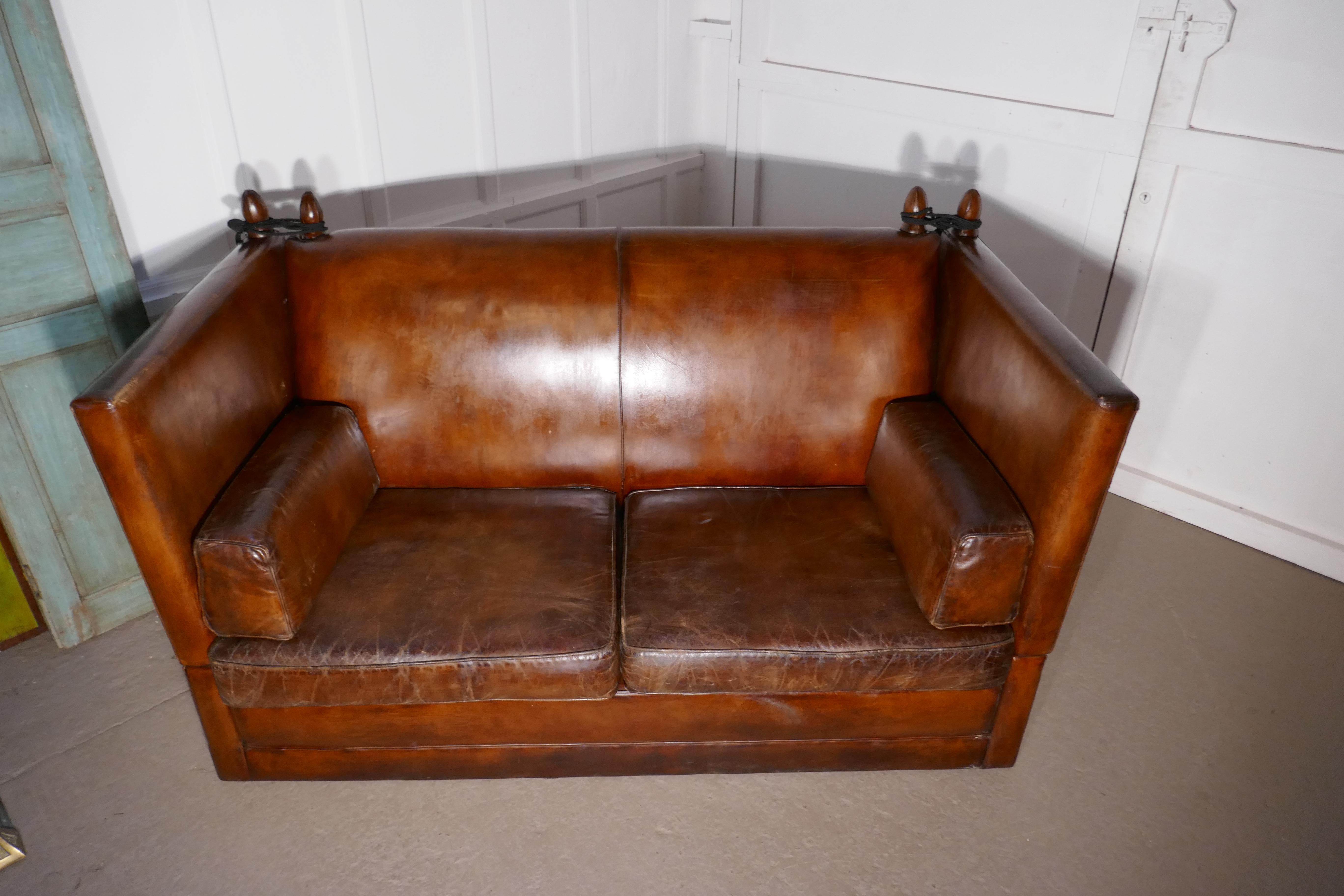 Large dark tan leather knole settee, 

This is a large and very comfortable piece, it is upholstered in its original leather, the leather is very thick heavy quality, and is very soft and pliable. The leather has slightly faded and creased with