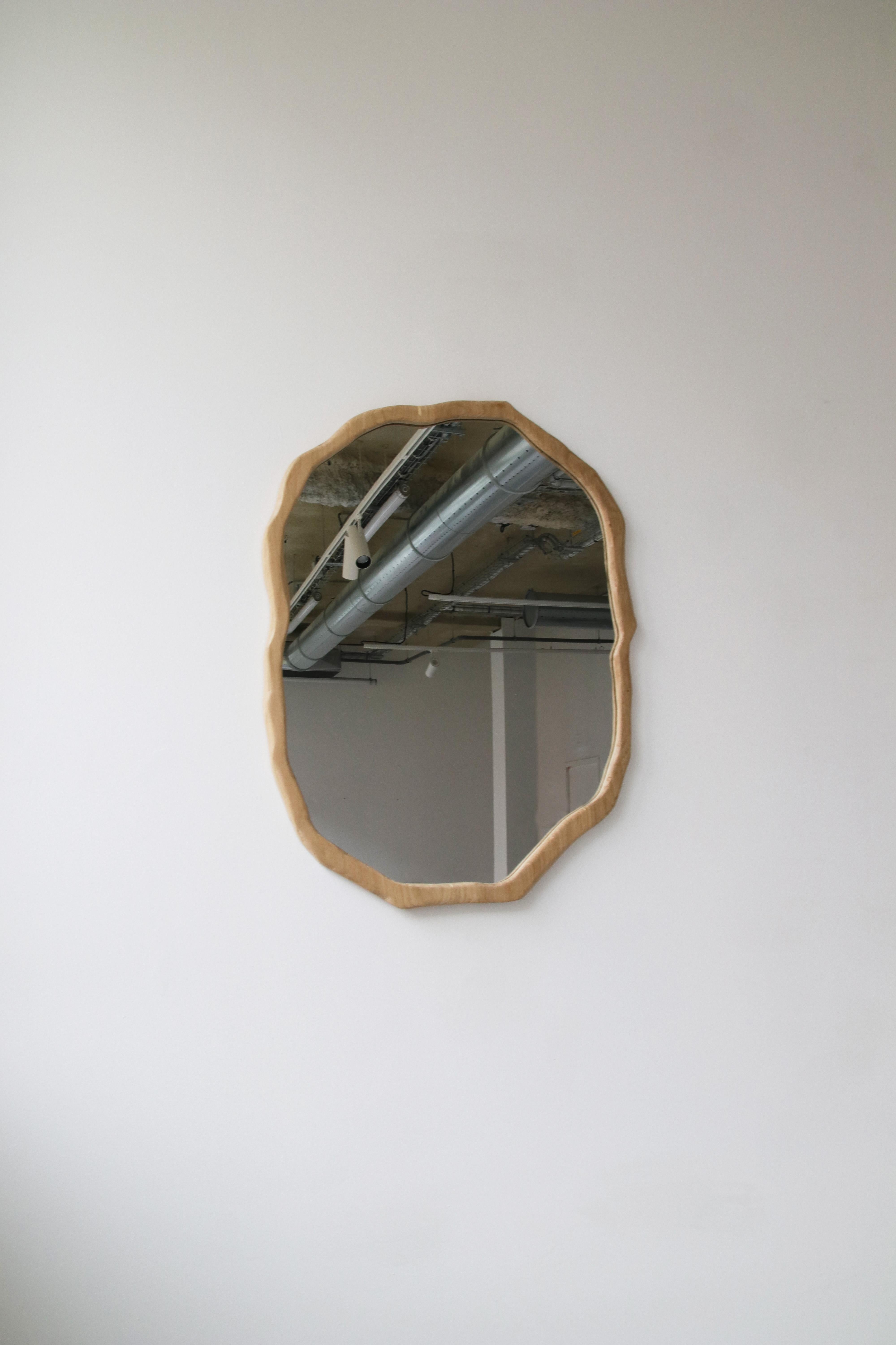 Large Dark Varnish Ondulation mirror by Alice Lahana Studio
One of a kind.
Dimensions: Ø 60 x H 70 cm.
Materials: Dark oak.
Available finishes: Light and dark varnish. 

Every mirror is unique. The shape slightly varies from edition to