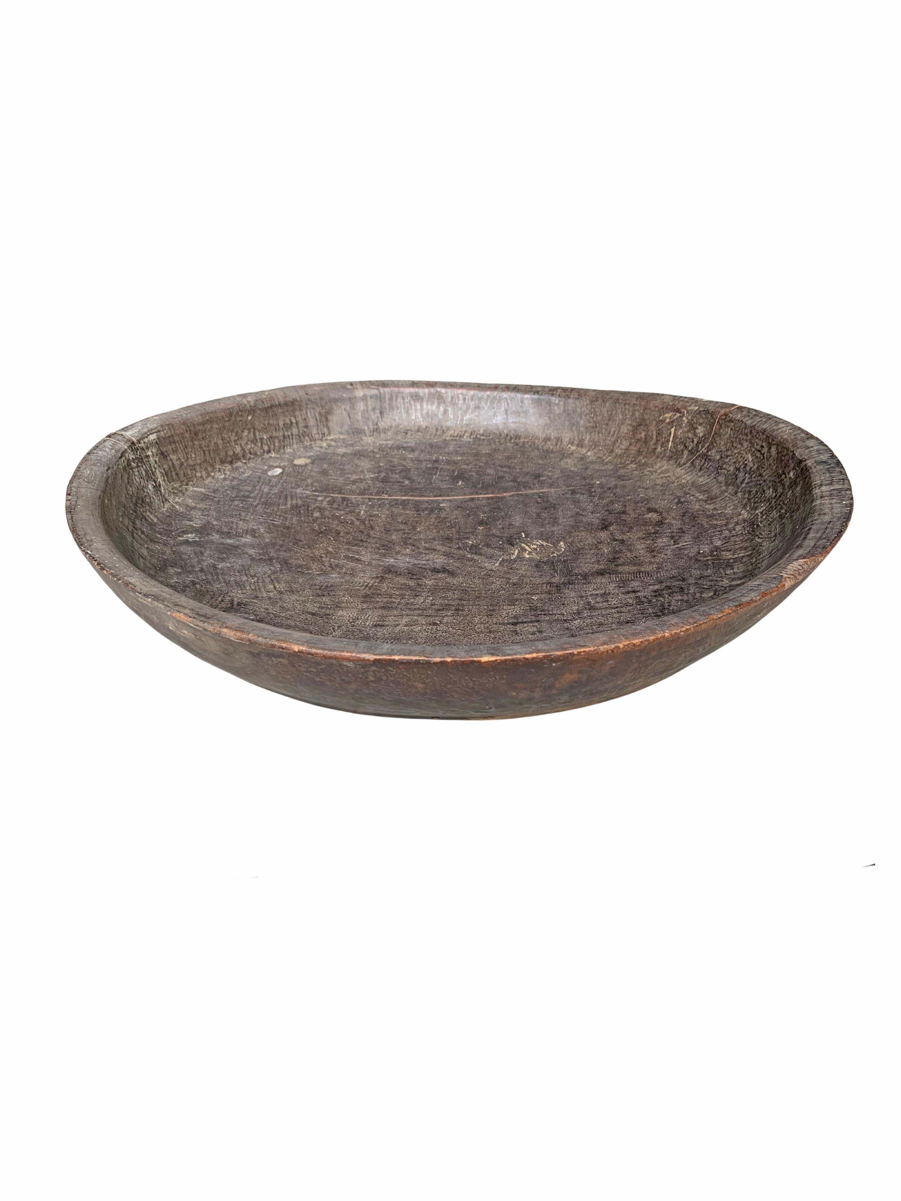 Crafted from ironwood this Dayak tribe ceremonial bowl features a wonderful smooth texture and subtle wood patterns all around. A wonderful decorative bowl or table centrepiece certain to invoke conversation. The Dayak Tribes are largely situated