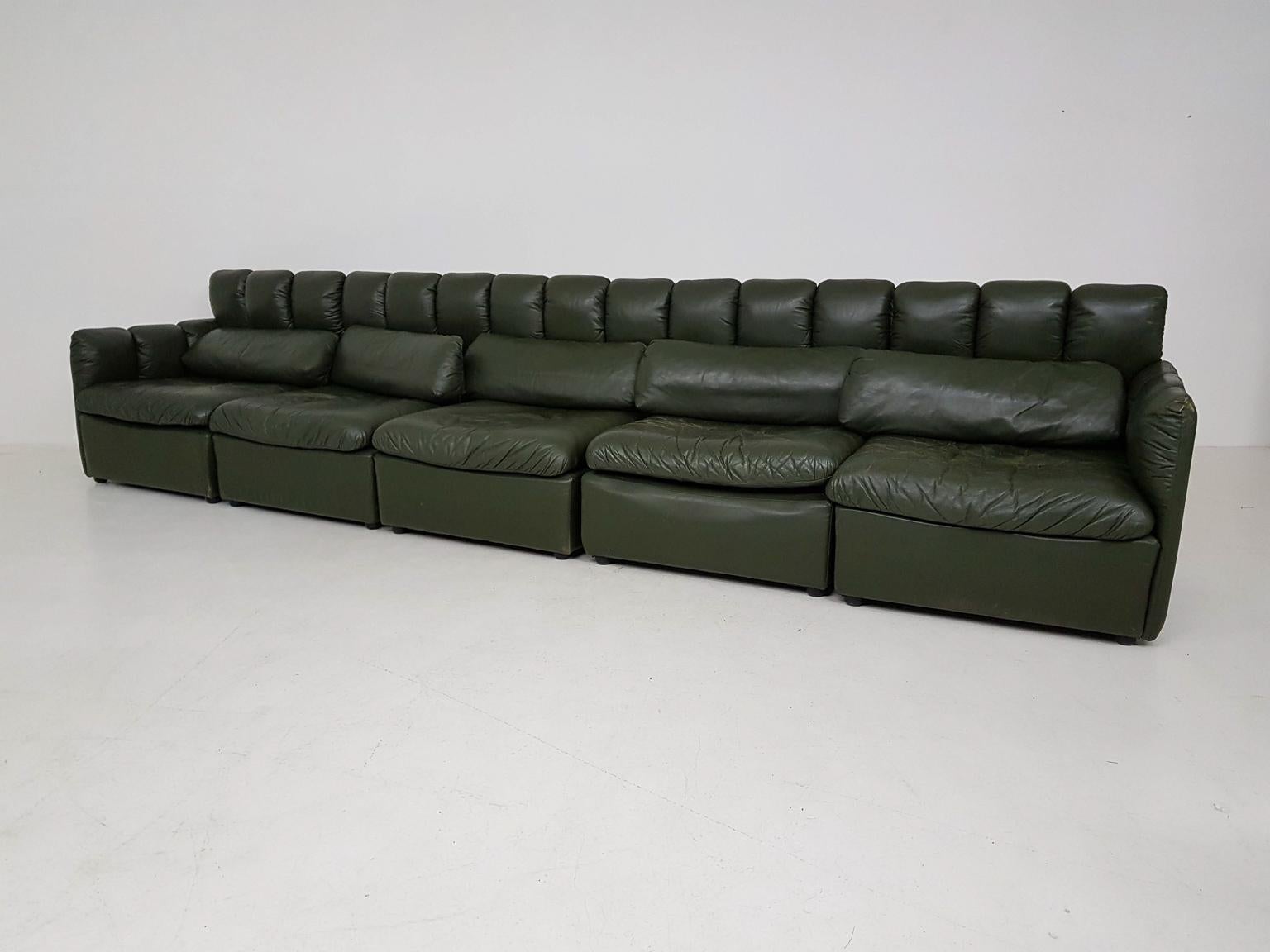 A large modular leather sofa in the style of De Sede, Knoll, Leolux, Lauser and COR. 

It is a European design from the 60's and very comfortable. The set consists of 5 elements: two with arm rests and 3 without. The back is made of 